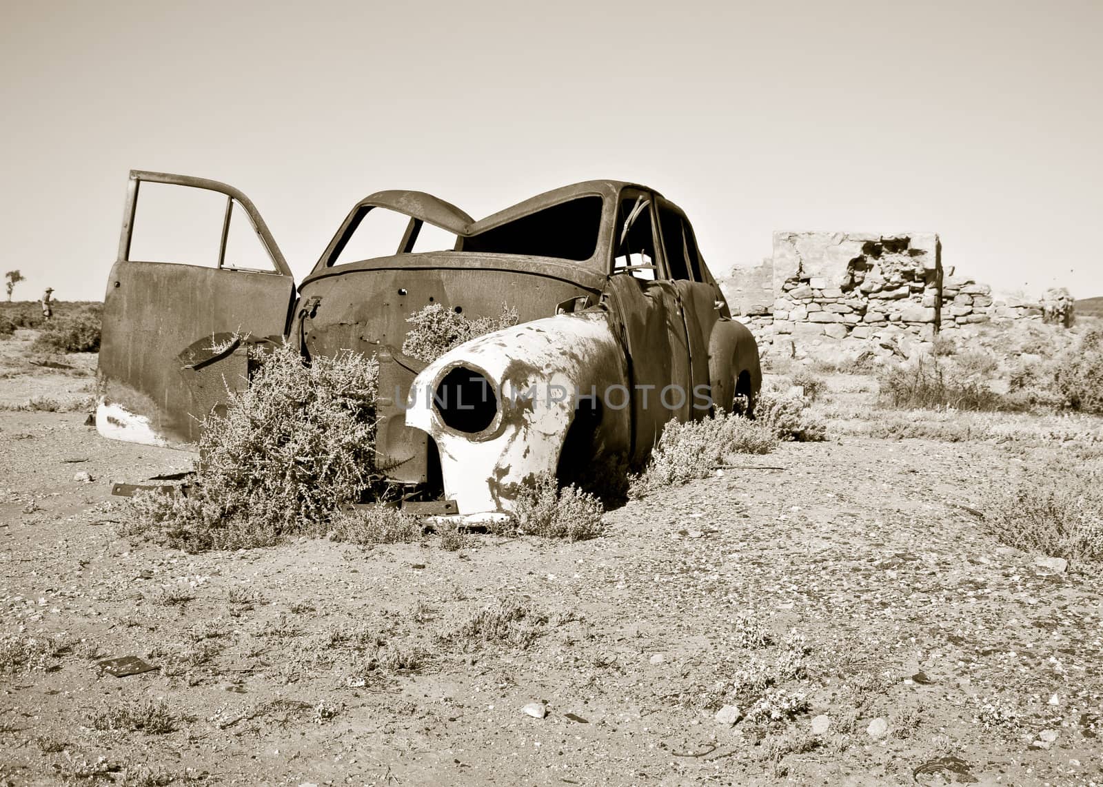 old rusty car in the desert 