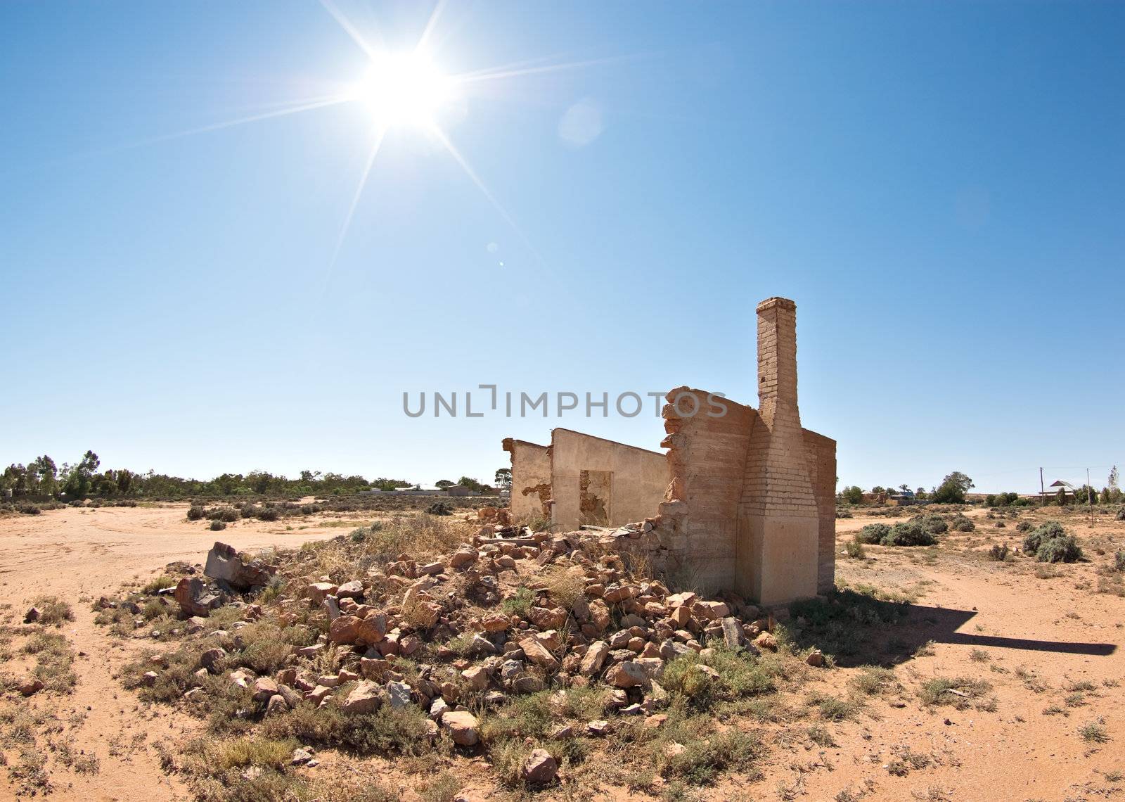 old rubble and ruins of a stone building in the hot sun of the desert