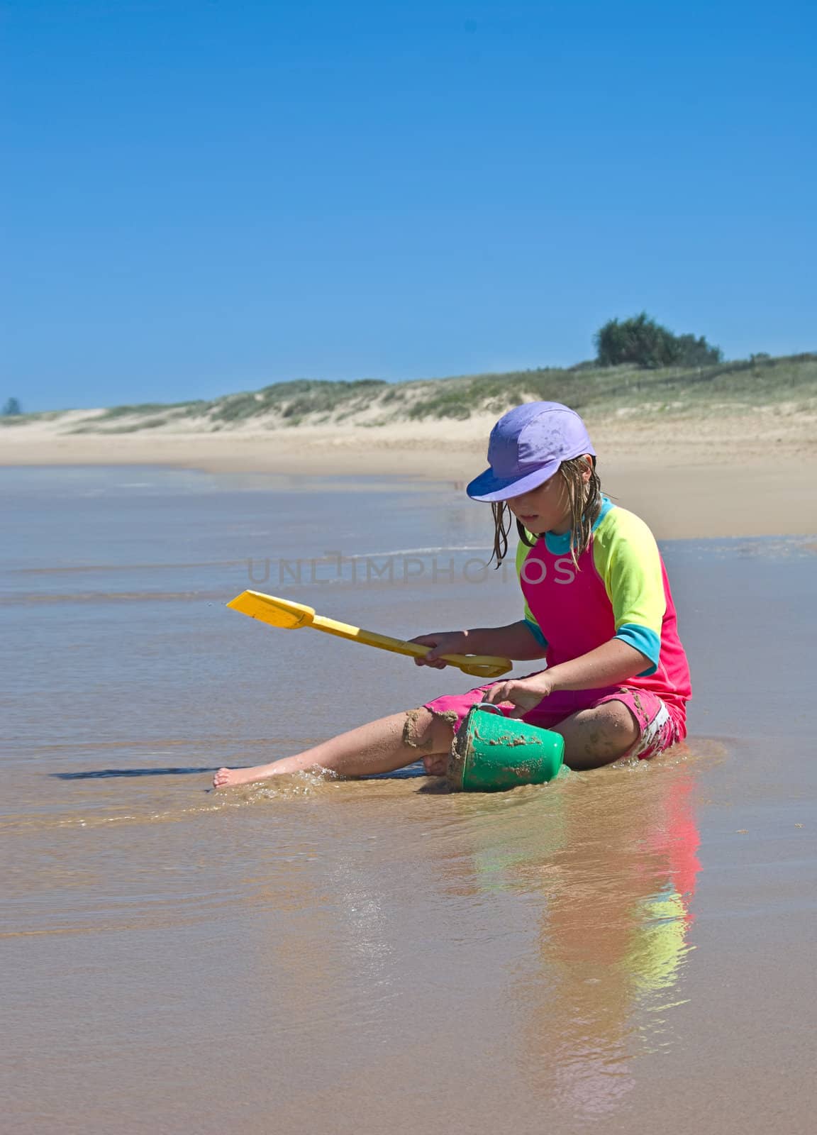 girl playing on beach