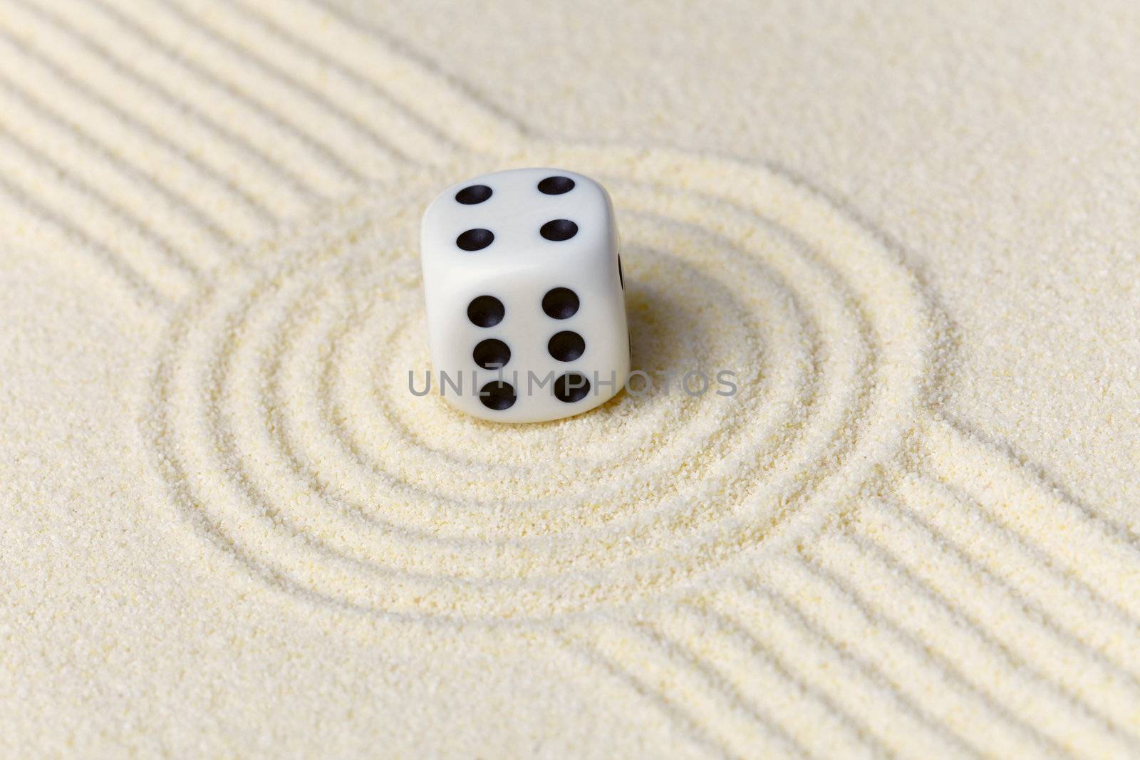 Composition on Zen garden - yellow sand, and dice