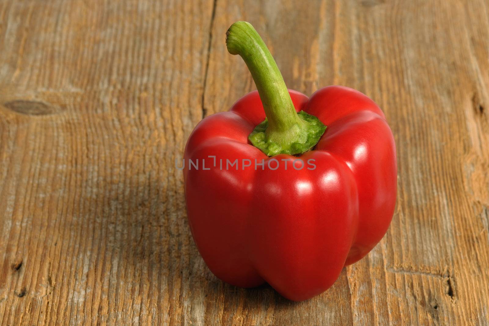 Red pepper on wood by sumners