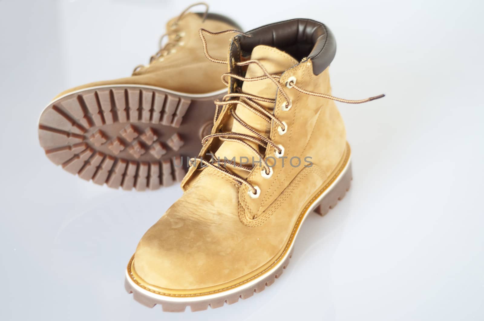 a pair of men\u0026#39;s leather boots with rubber soles