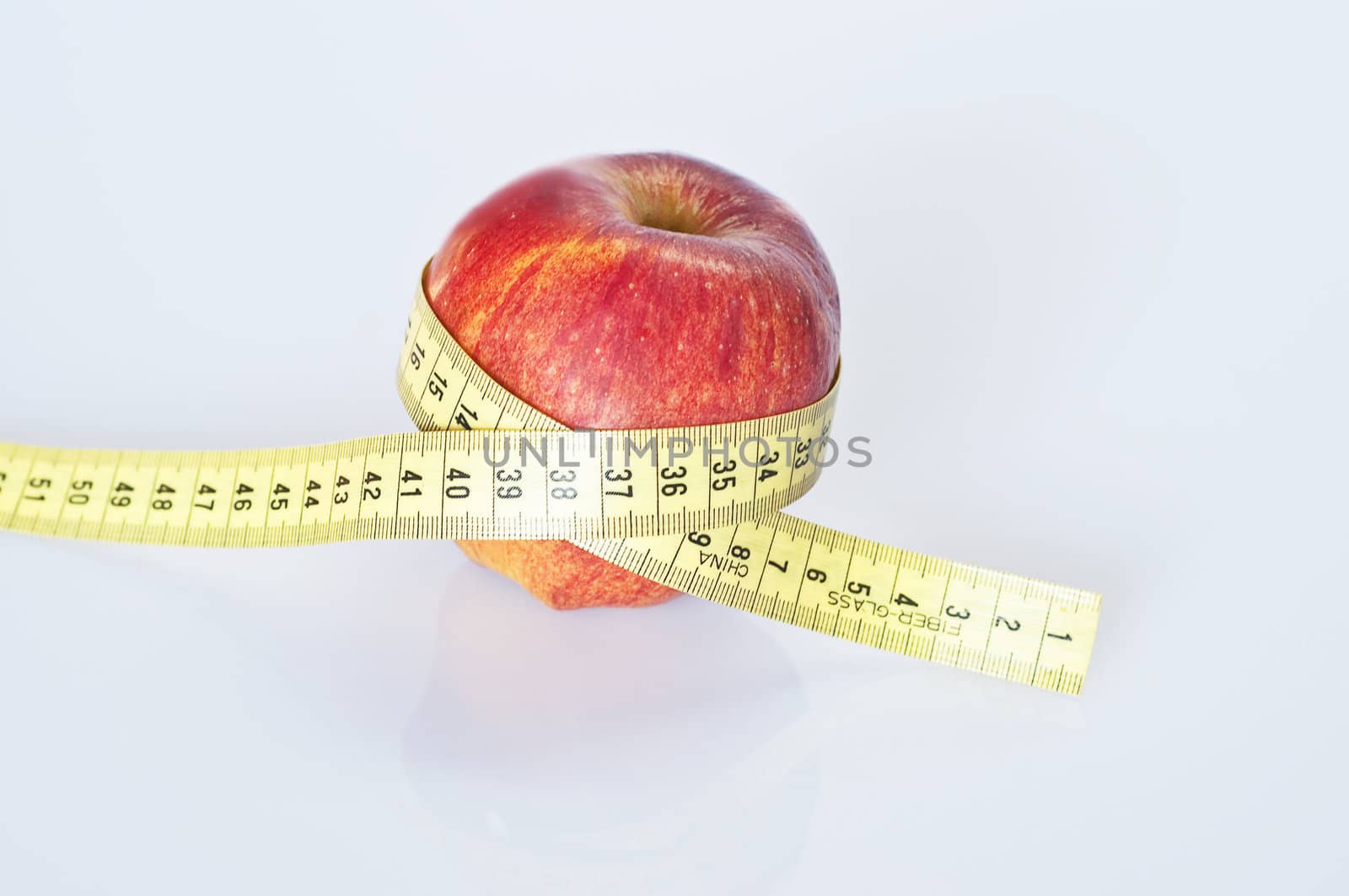 apple with centimeter measures the circle on a white background