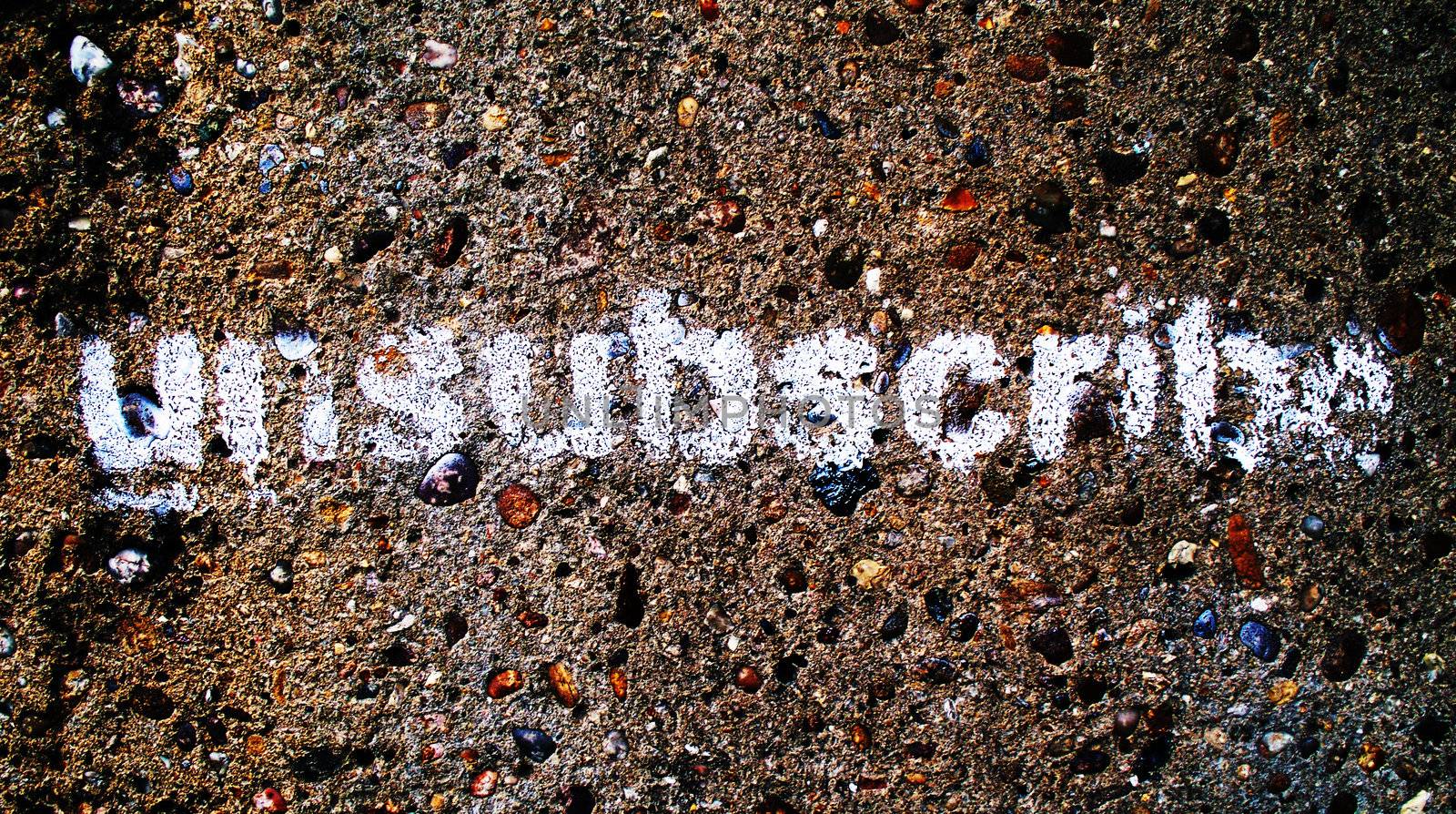 A stencilled graffiti word Unsubscribe, could be used as a button on a website or as a social protest statement