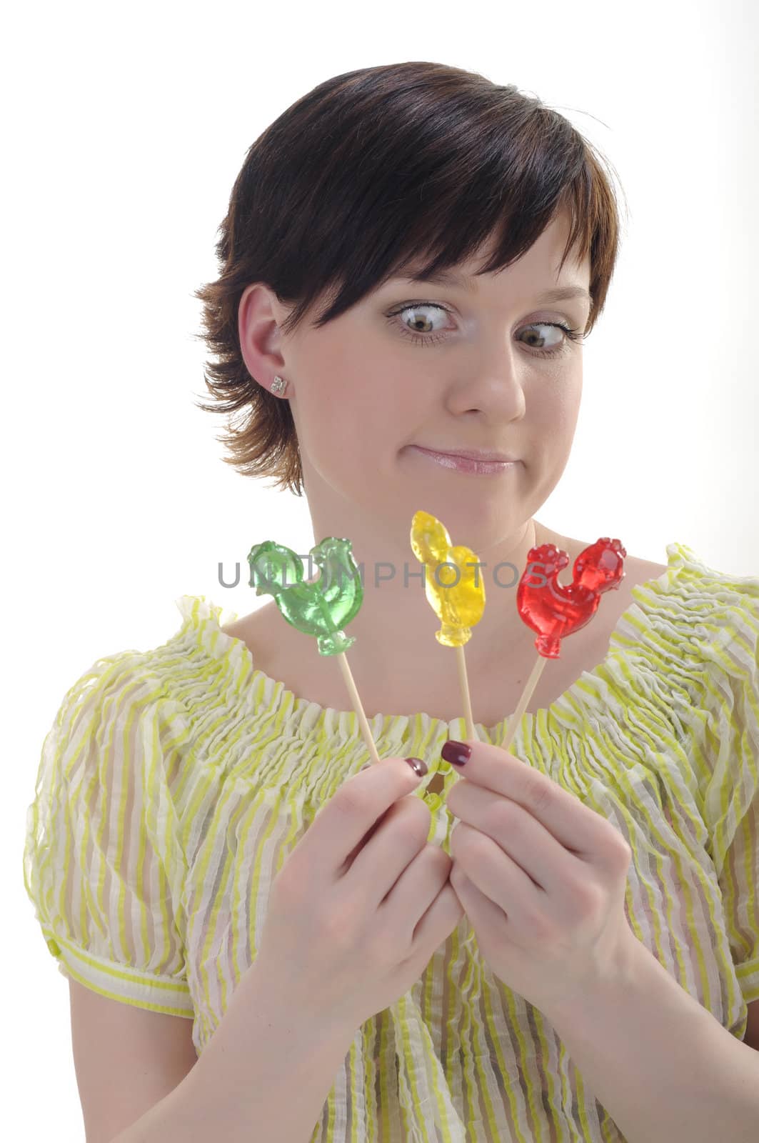 Surprised woman with red, green and yellow candies