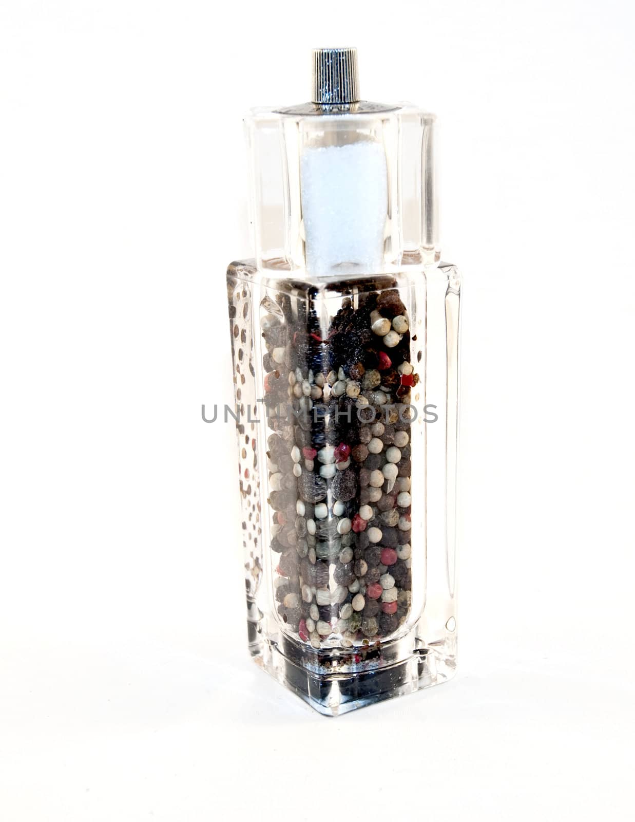 grind salt and pepper on white background