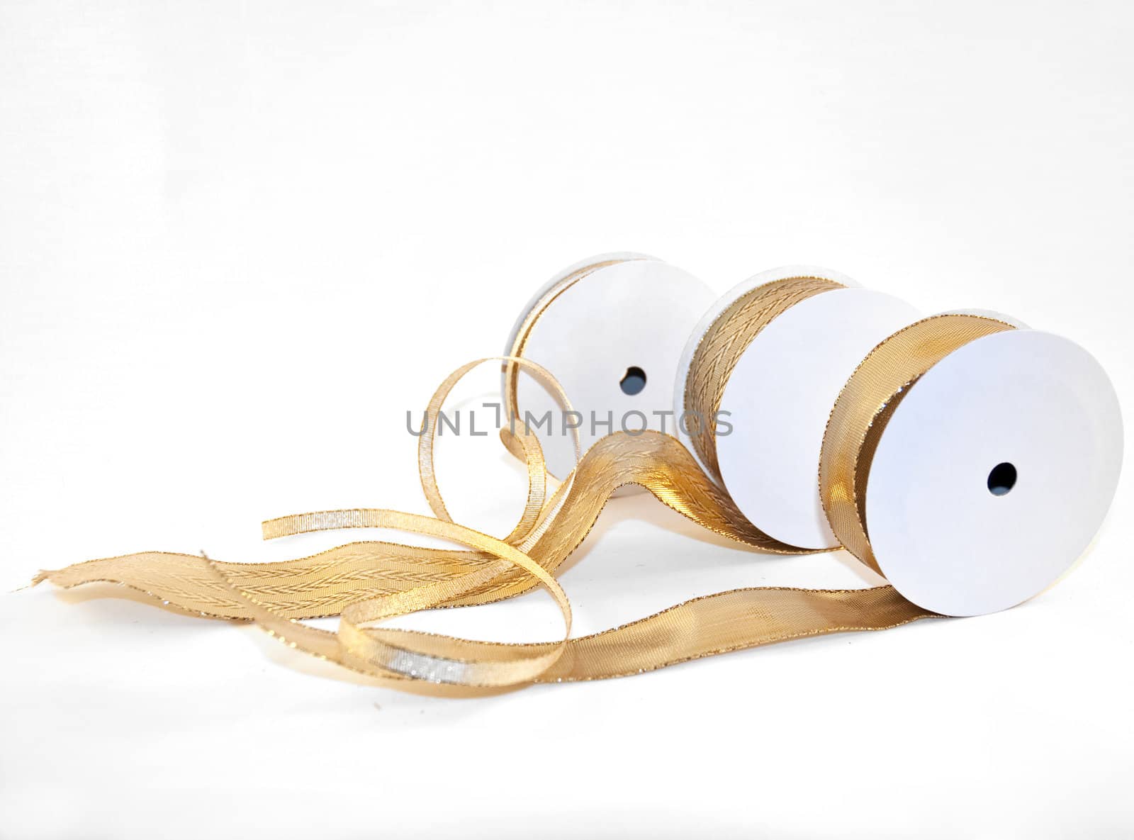 three different types of gold ribbons on white background
