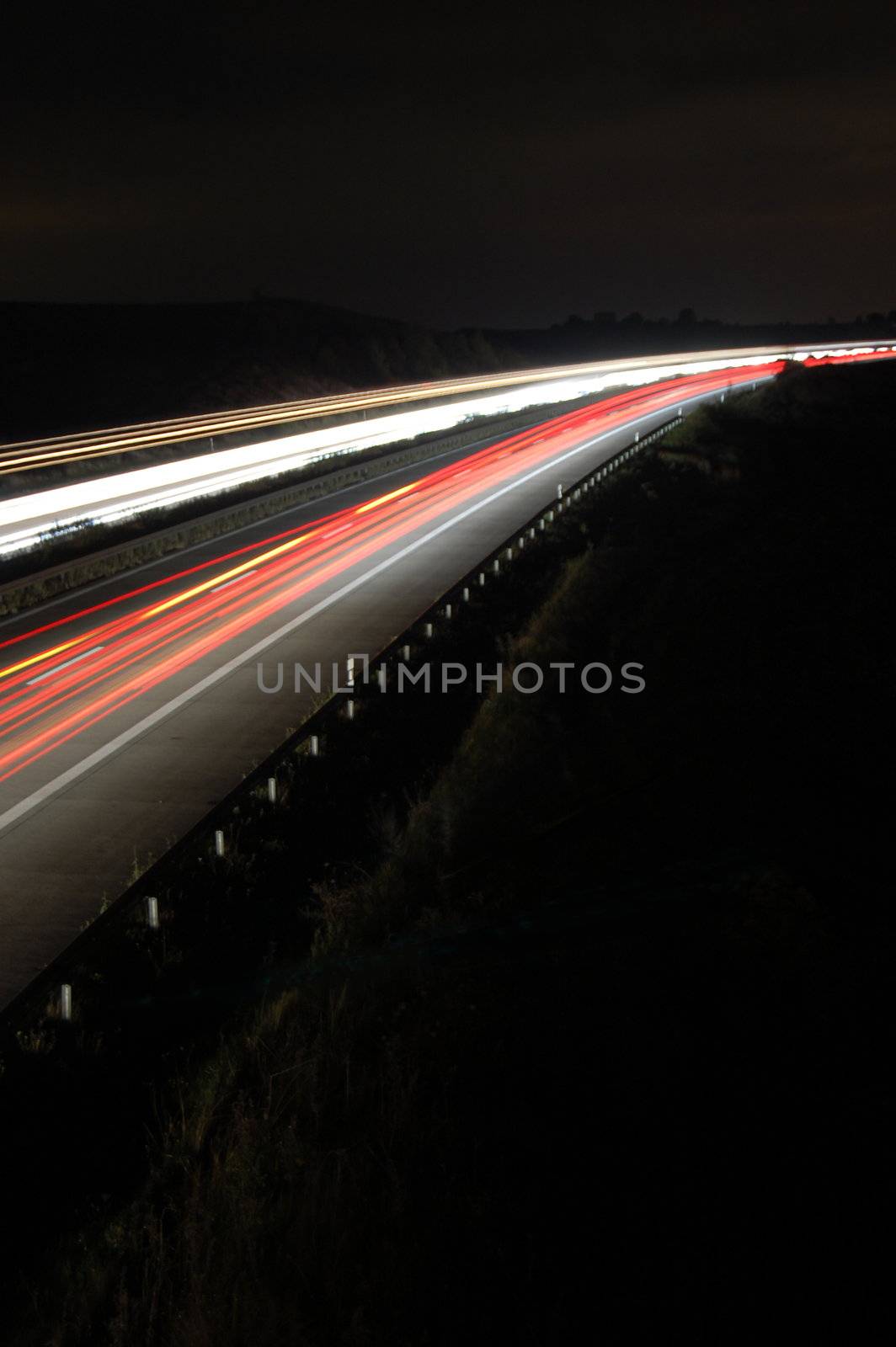 highway at night with traffic by gunnar3000