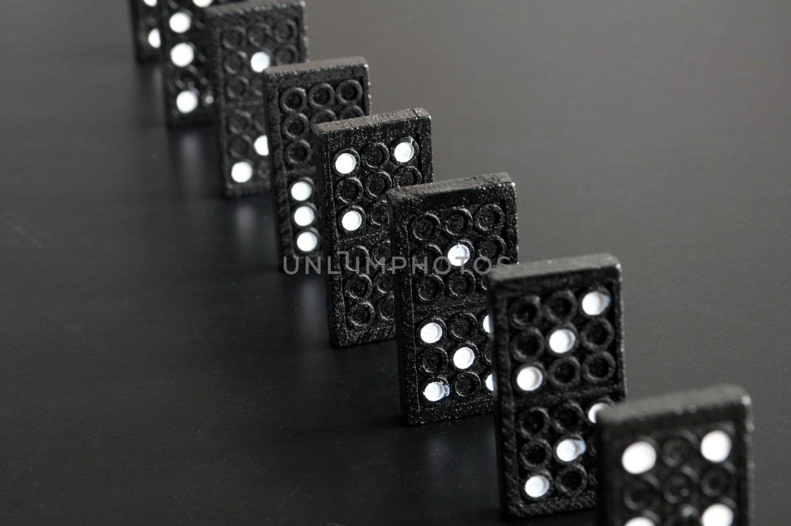 black domino showing financial or economic crisis concept