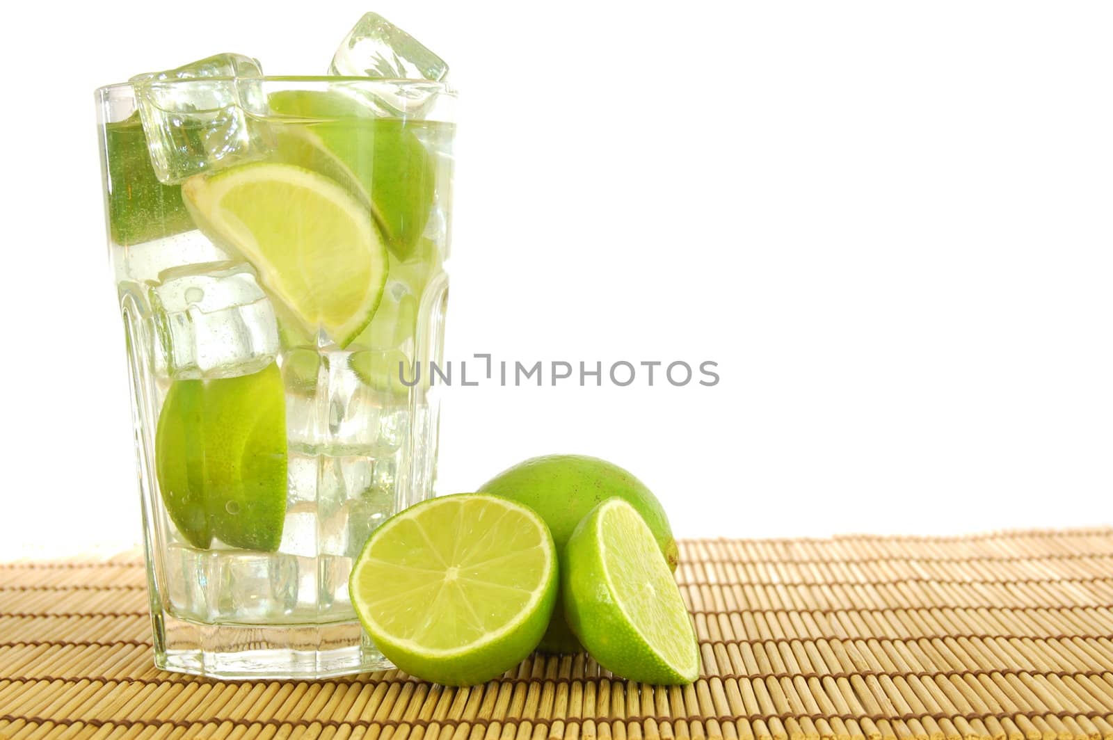 fresh Caipirinha with lemon on white background