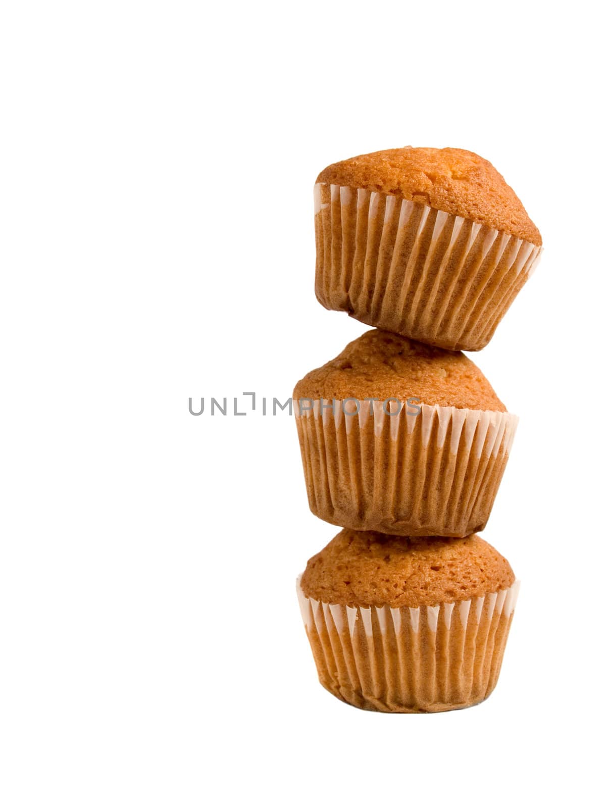 A pile of three muffins isolated over white background.