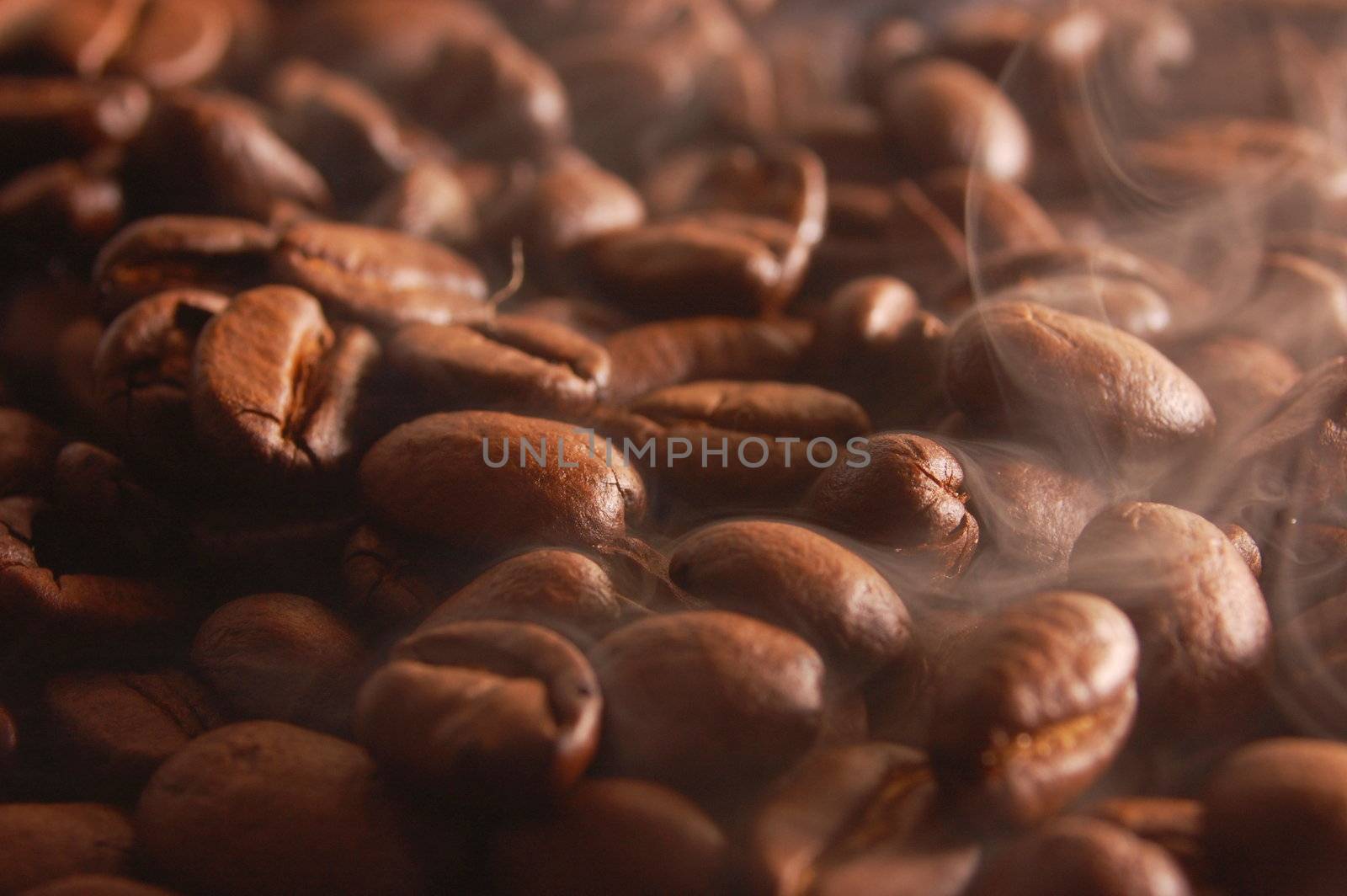 roasting coffee beans with steam and smoke