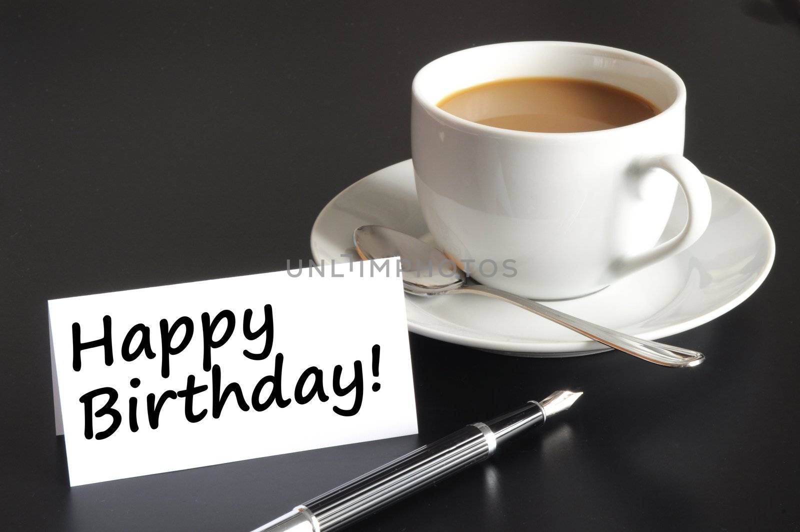 happy birthday greeting card with cup of coffee on black