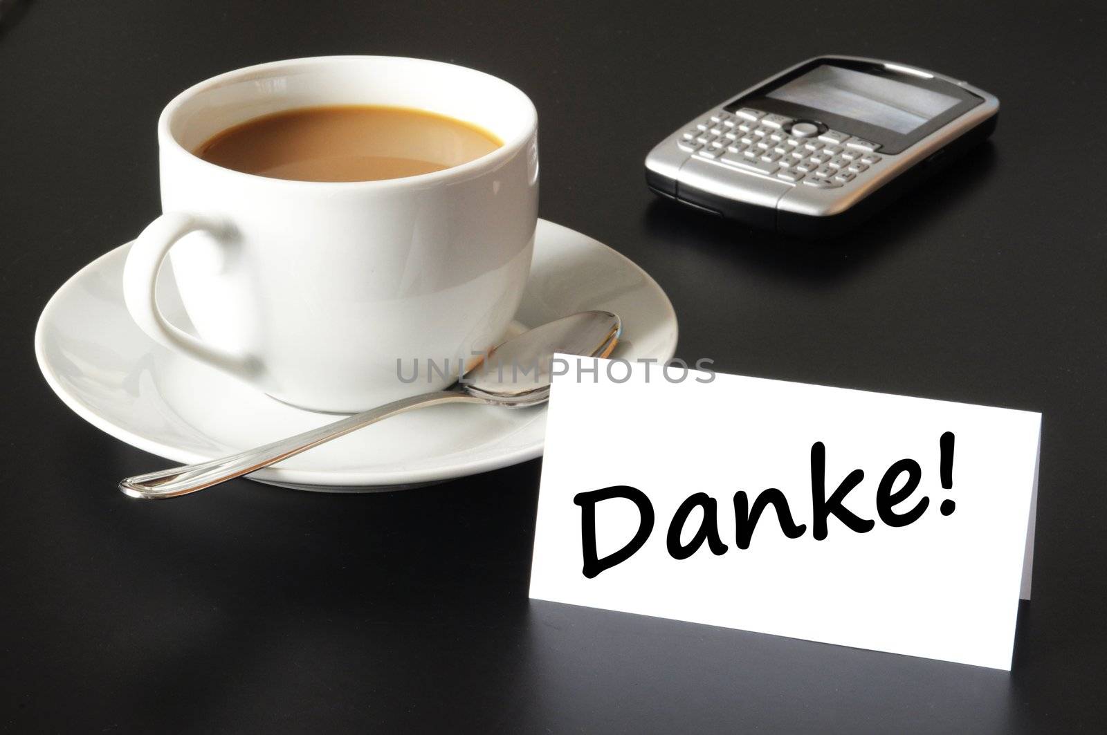 thank you or thanks concept with cup of coffee on black background