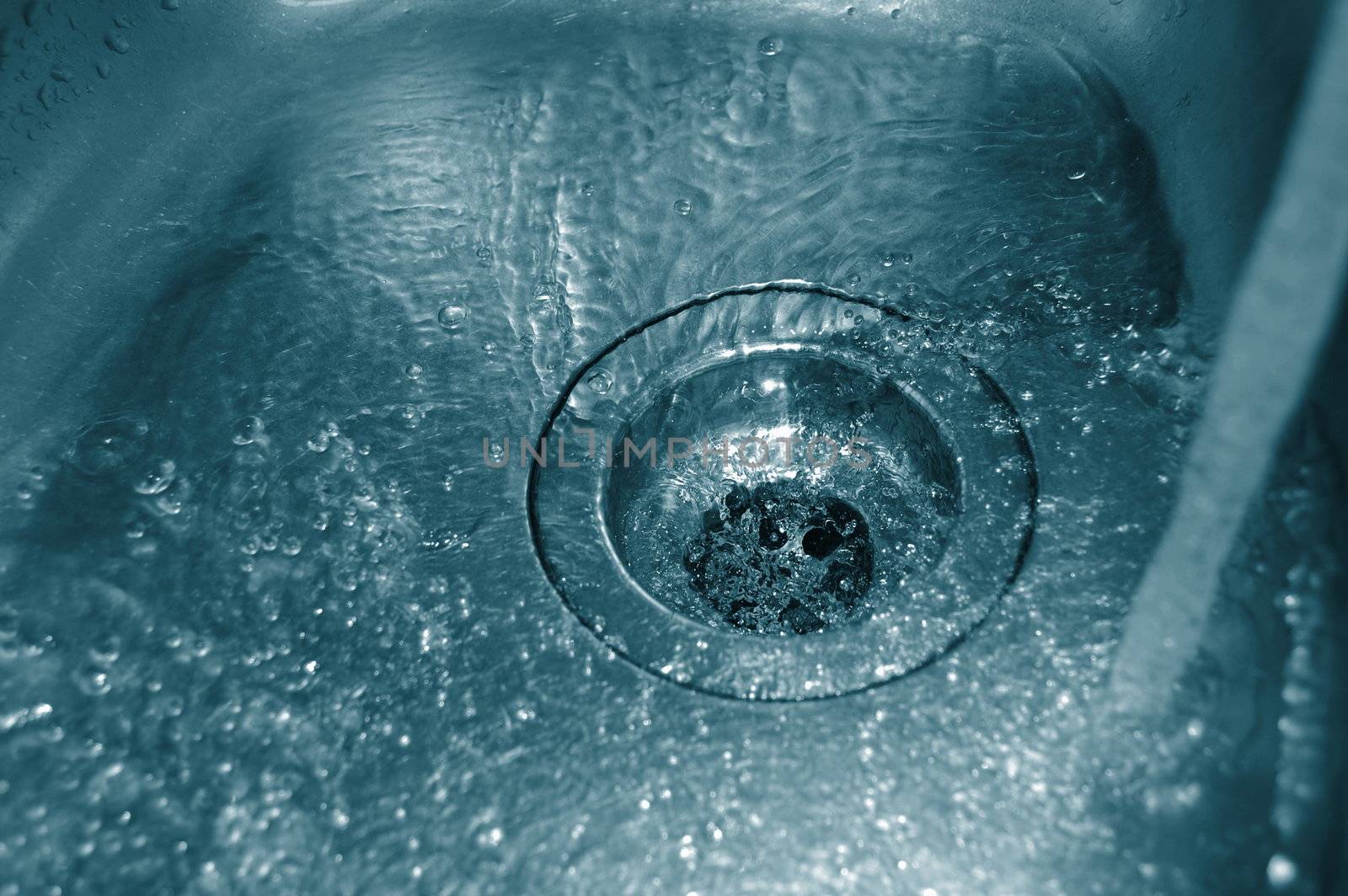 water flow into the drain in the kitchen