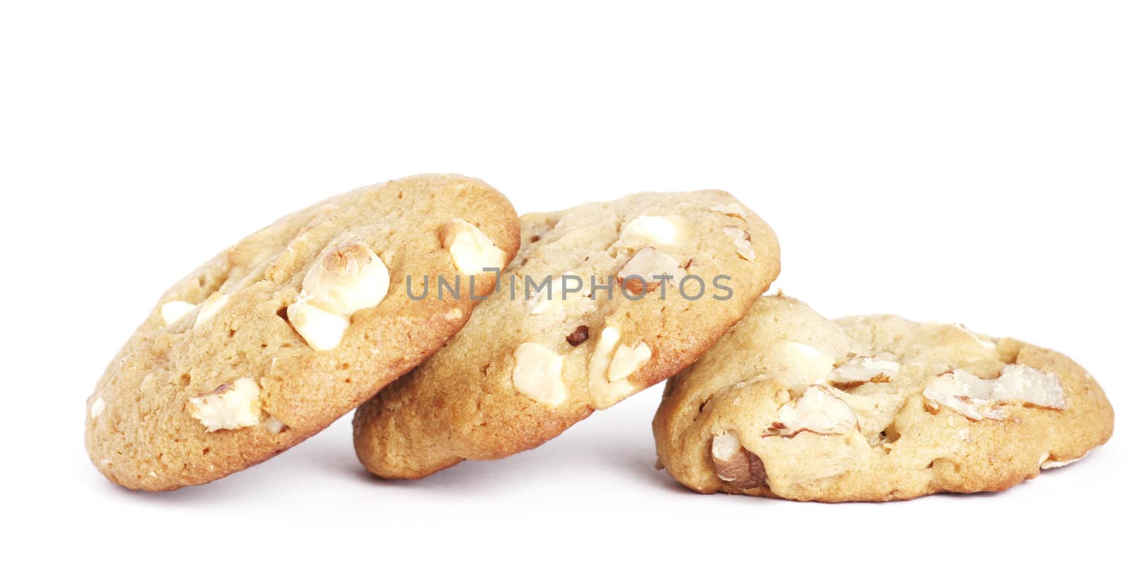 Three  Cookie Biscuits With White Chocolate And Macadamia Nuts, Plain Background