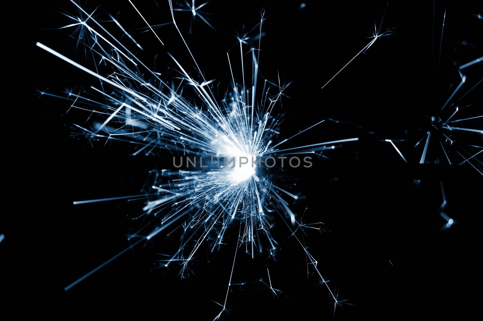 holiday sparkler isolated on black background with copyspace