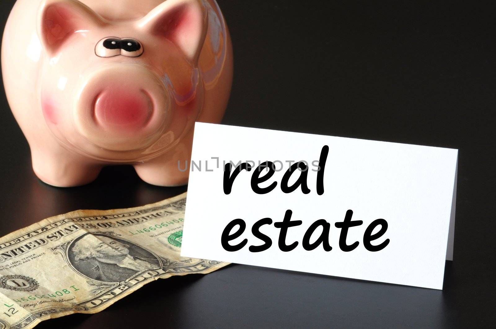 save money for real estate in your piggy bank