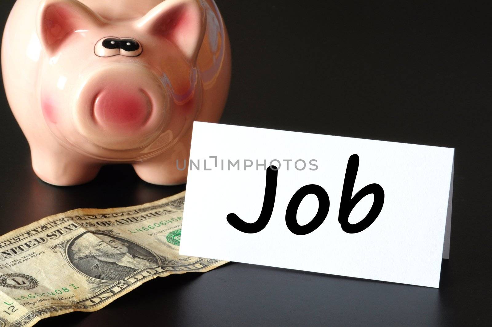 job concept with piggy bank on black background