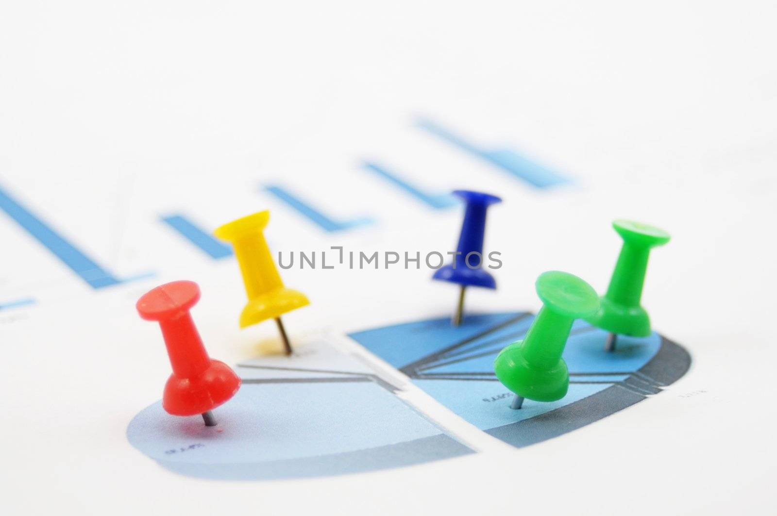 statistical business data and push pin showing growth