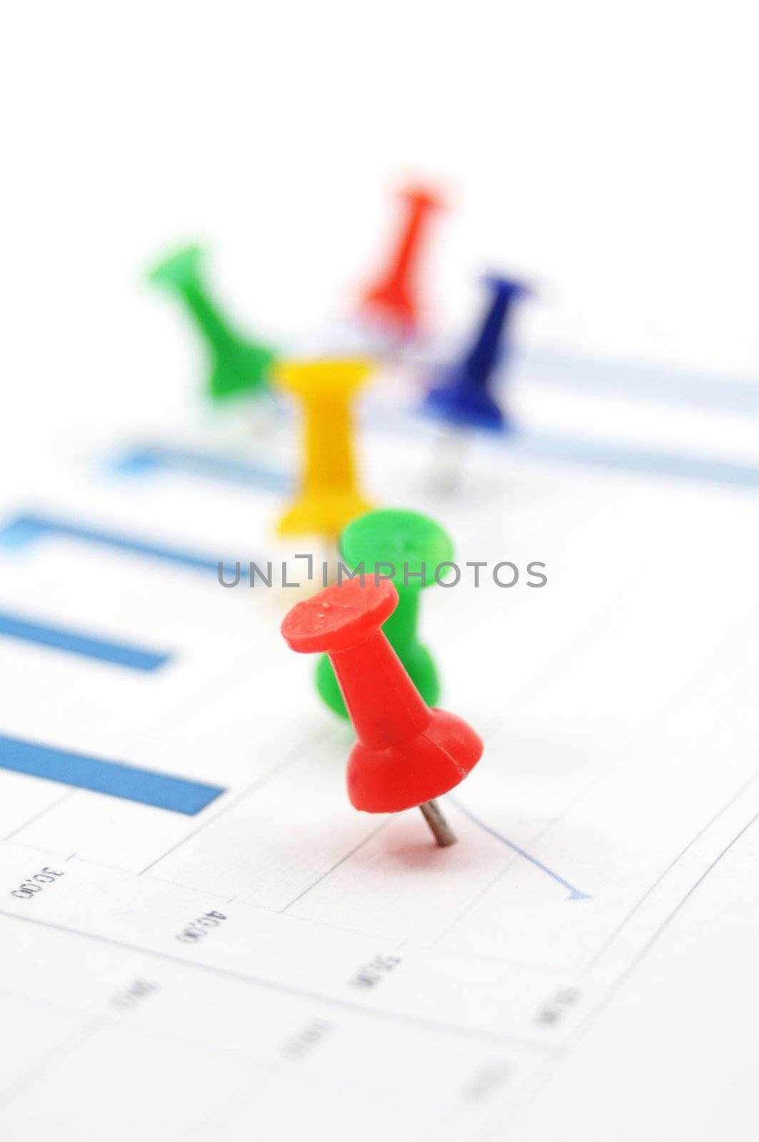 statistical business data and push pin showing growth