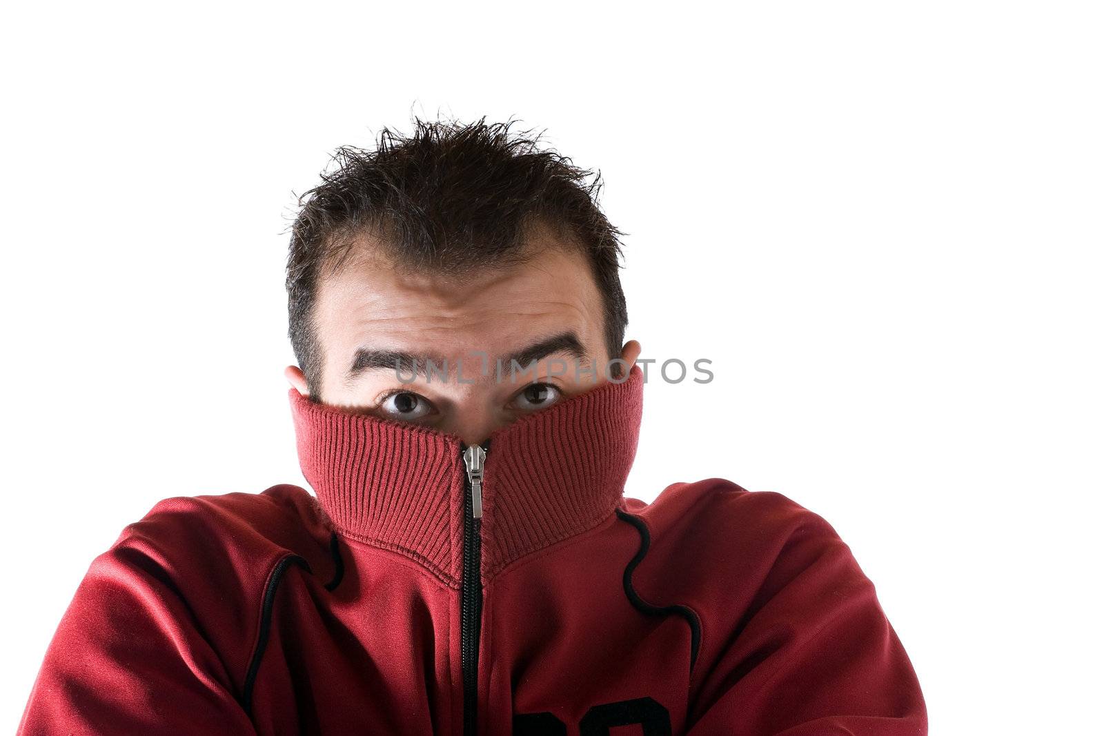 A cold man shivering and burying his face into his sweater. A great concept for HVAC.