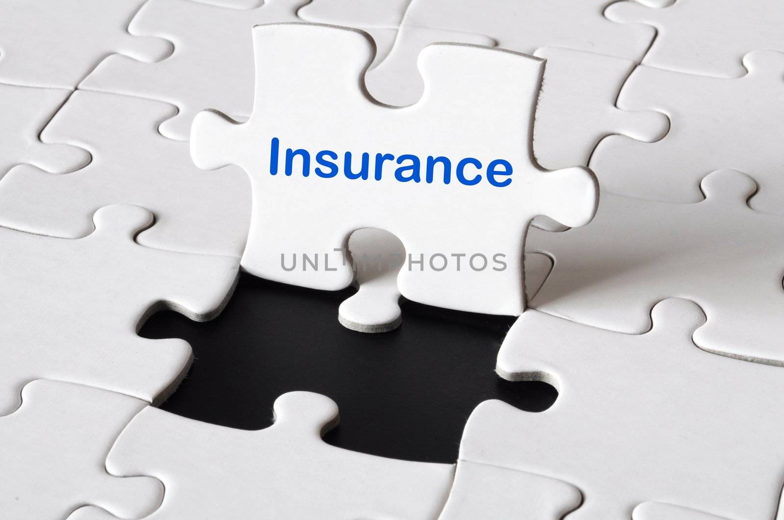 insurance concept with white puzzle or jigsaw