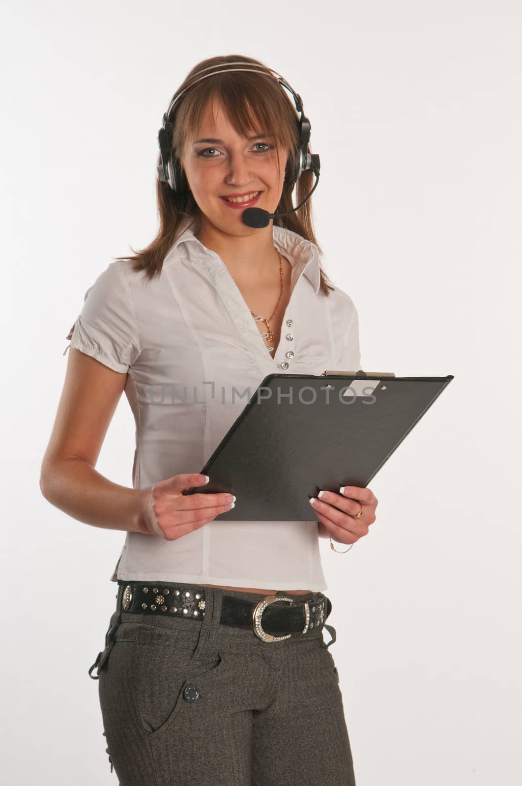 Closeup portrait of a happy young call centre employee  by Erchog