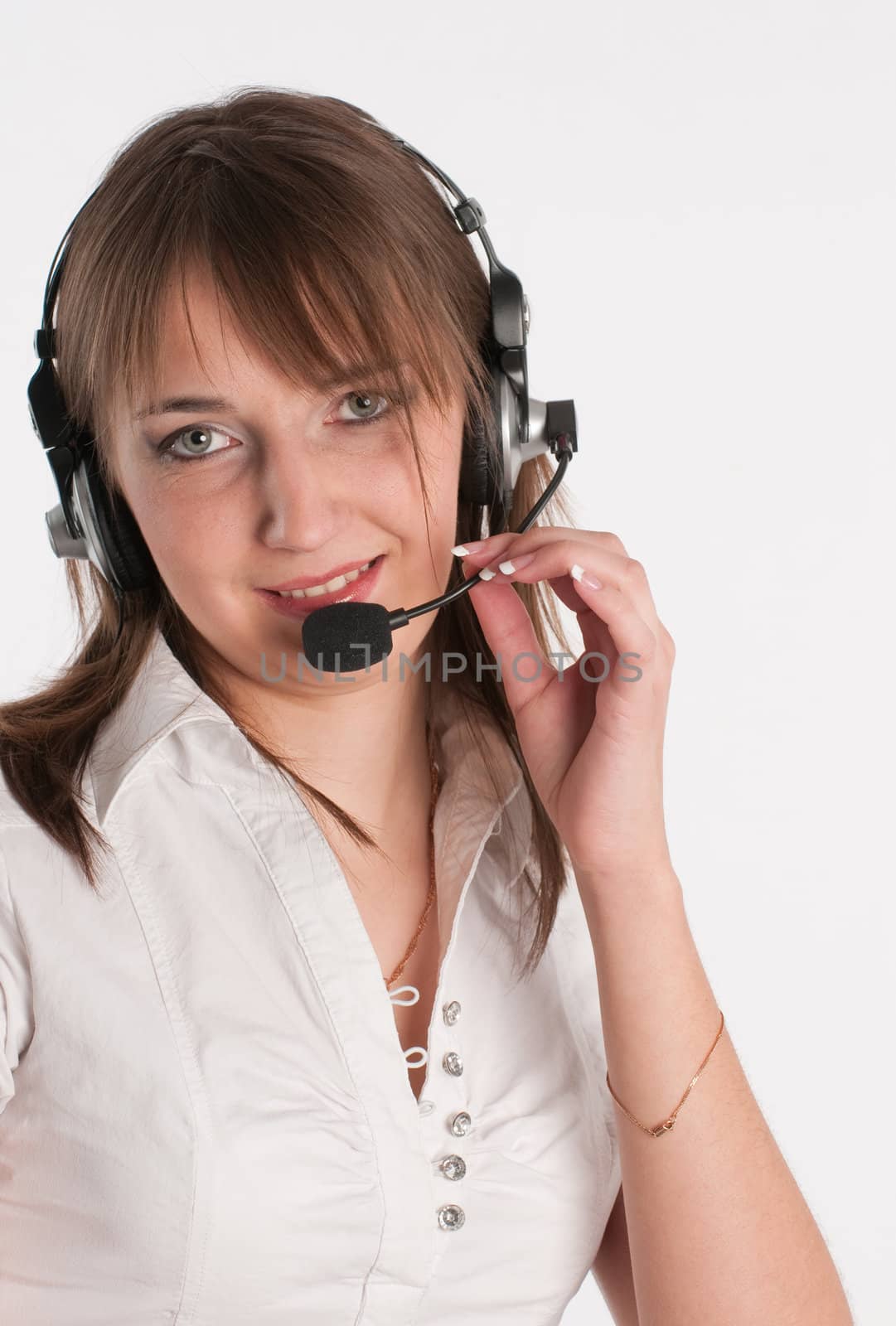 Closeup portrait of a happy young call centre employee  by Erchog