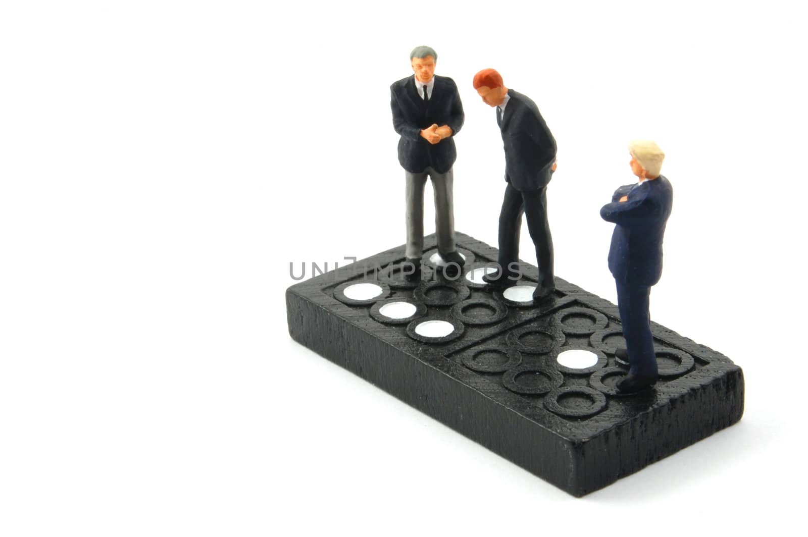 business man on domino isolated on white background