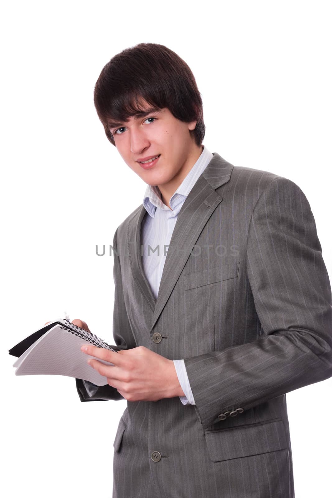 Young businessman or student with notepad by rozhenyuk