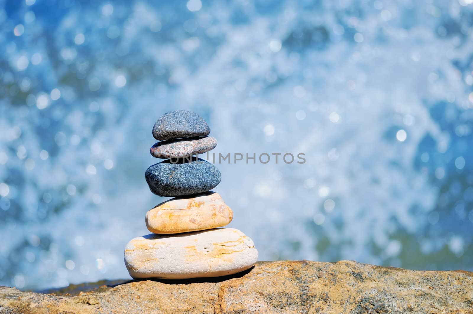 Pile of pebble on the background of water drops