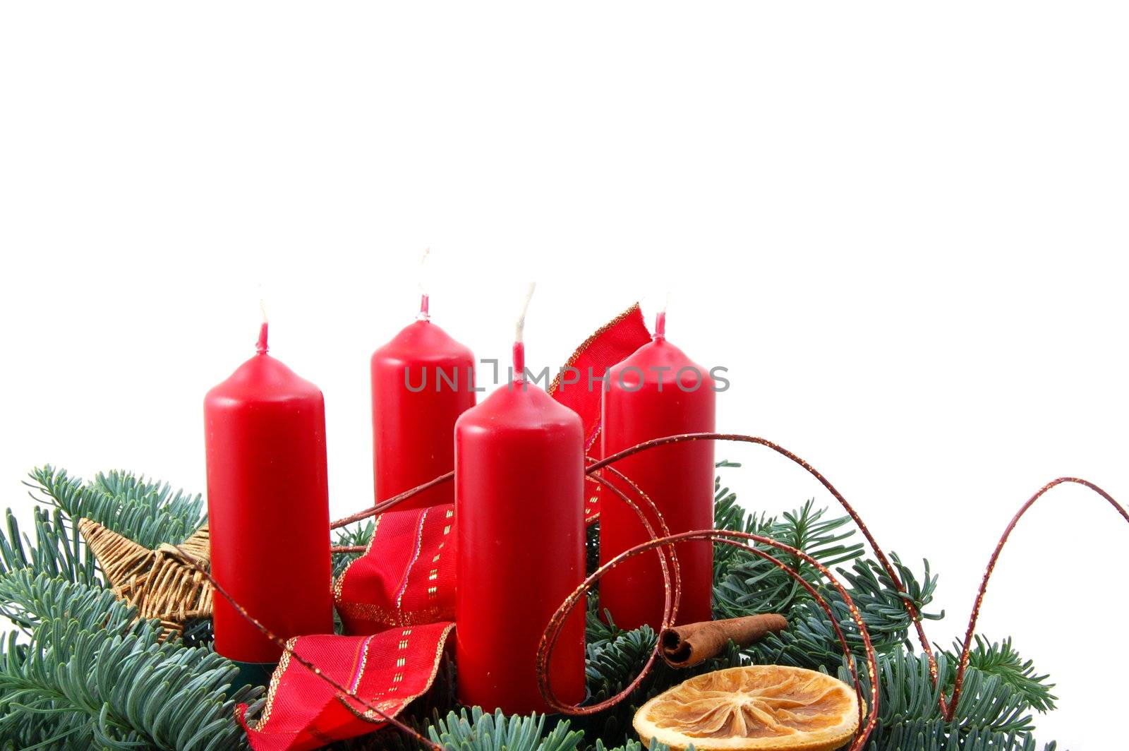 christmas wreath isolated on white background with red candles