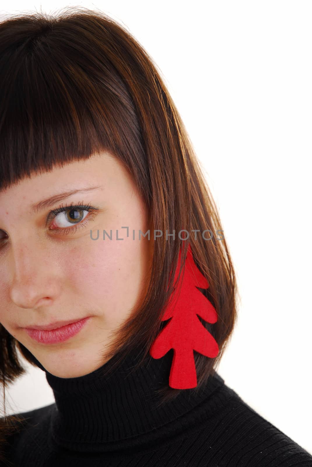 Young woman with new year tree as ear ring