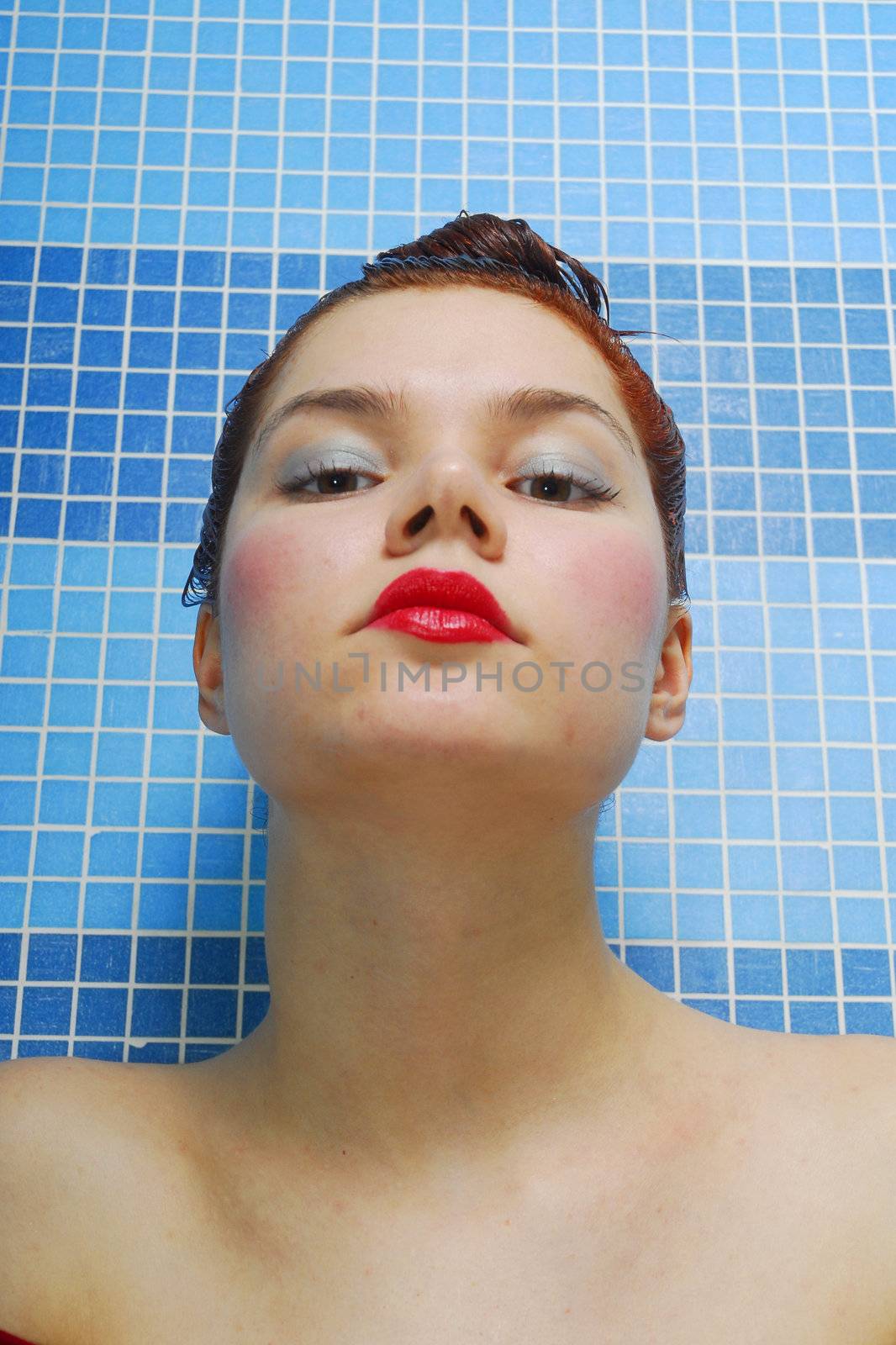 Woman with passionate look on a blue background