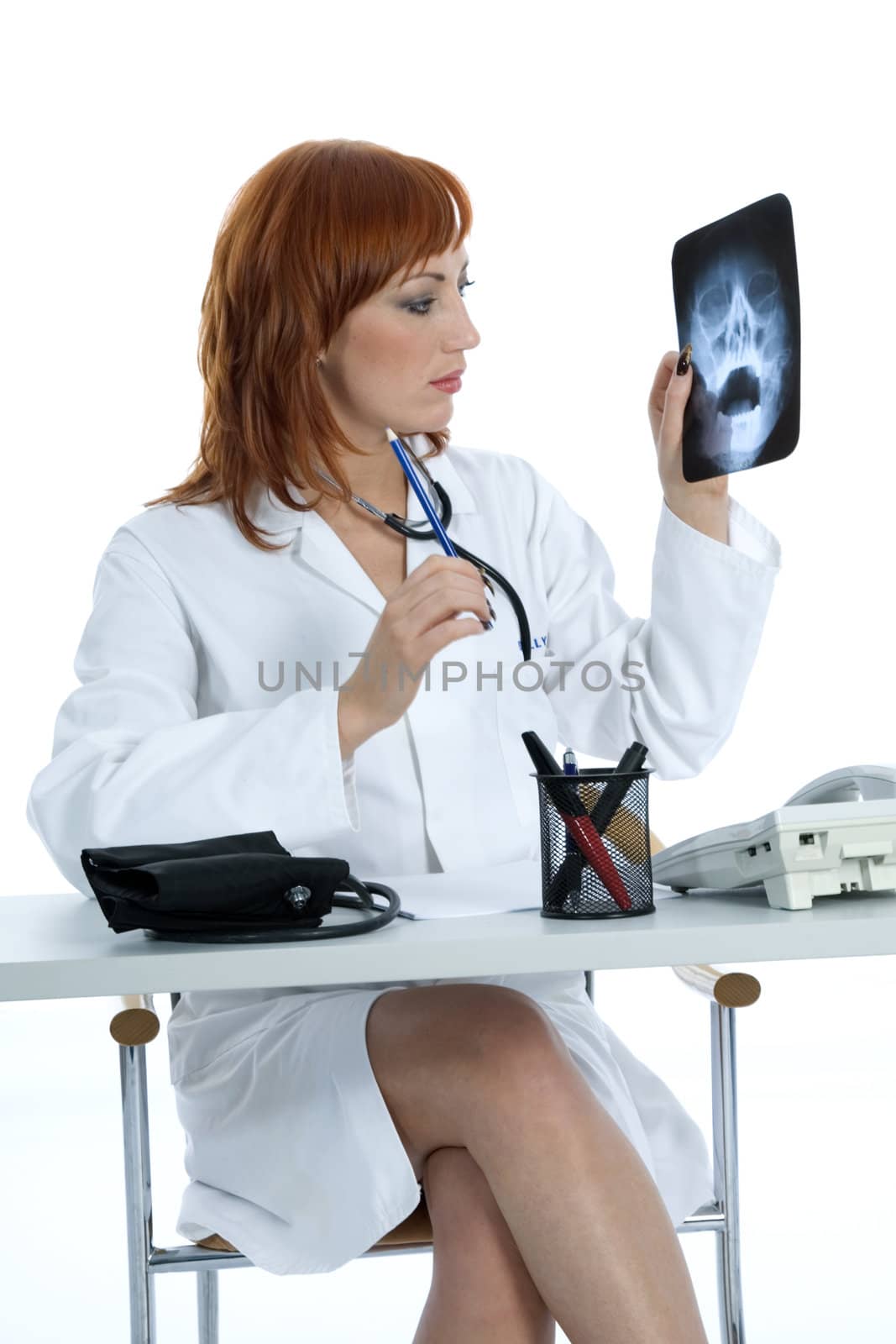 young doctor with stethoscope on isolated background