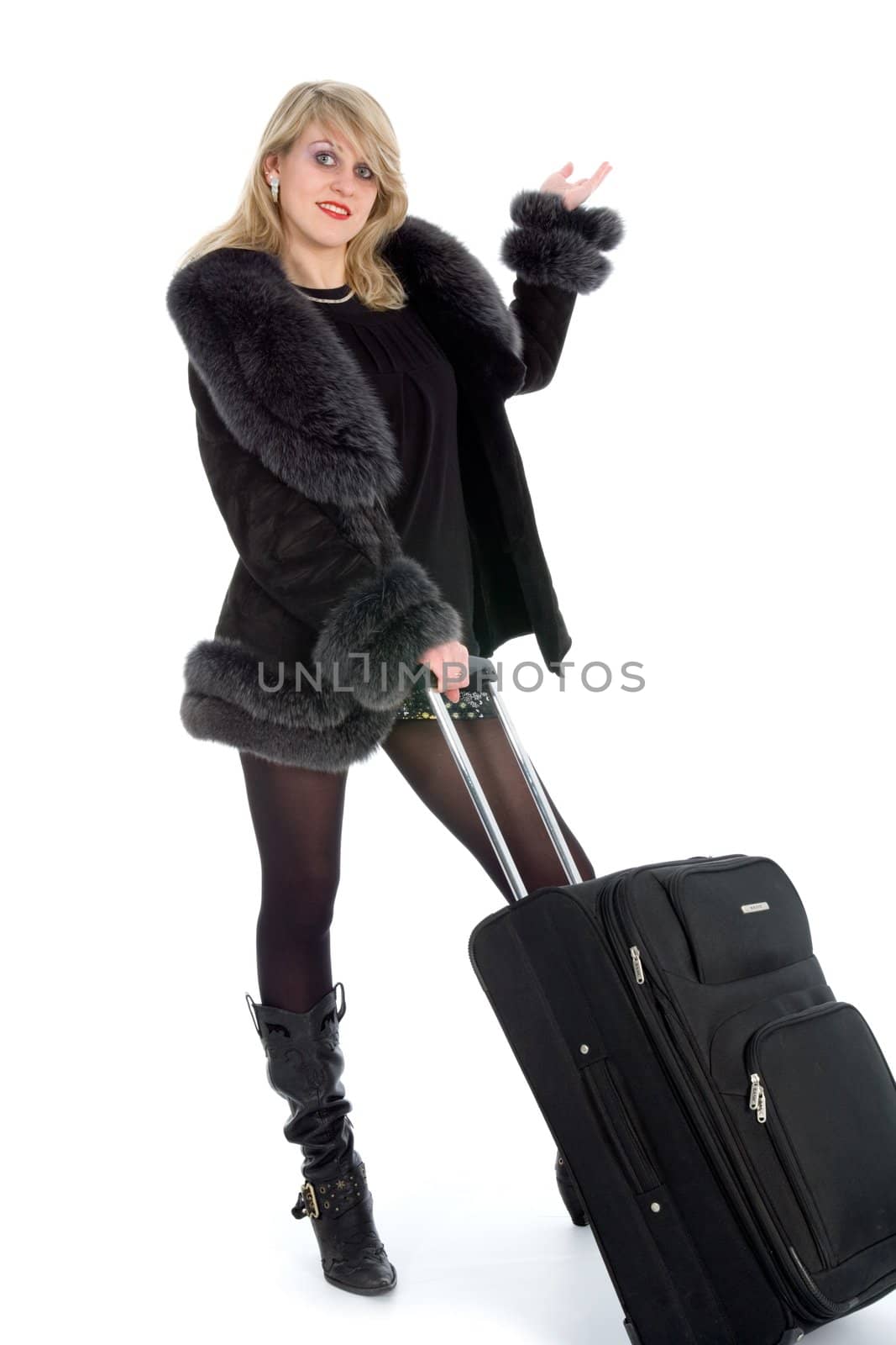 Beautiful blonde with valise on black background