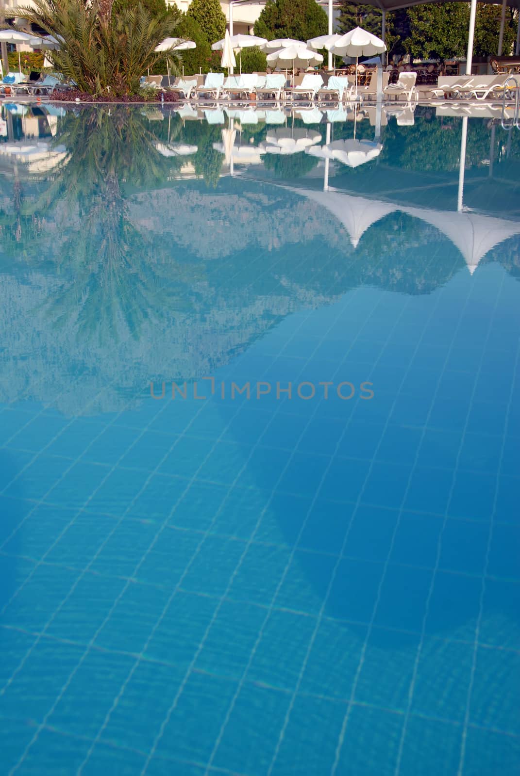 swimming pool at mediterranean summer resort hotel in Turkey