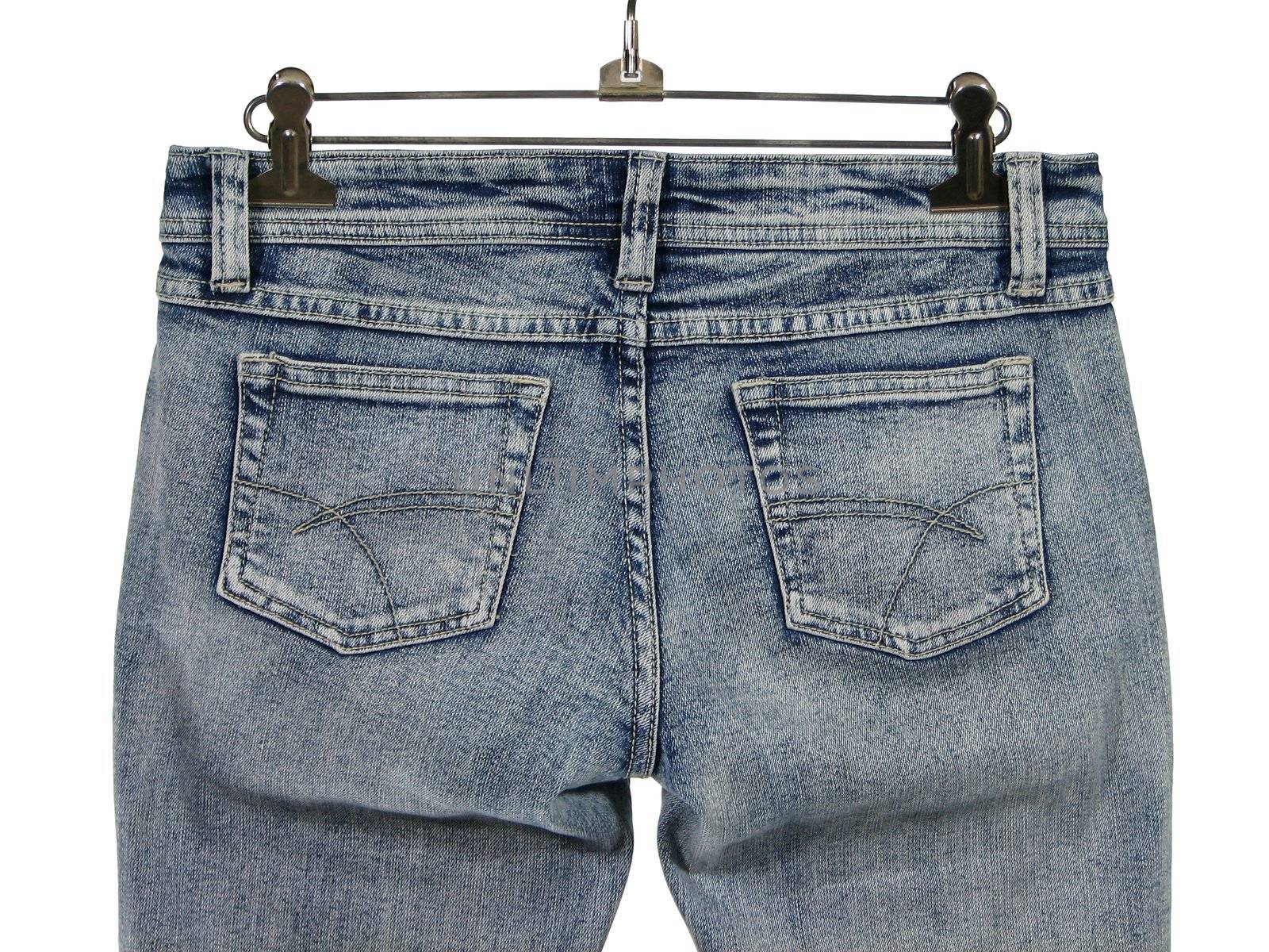 Closeup of blue jeans with pockets, rear view. Isolated on white.