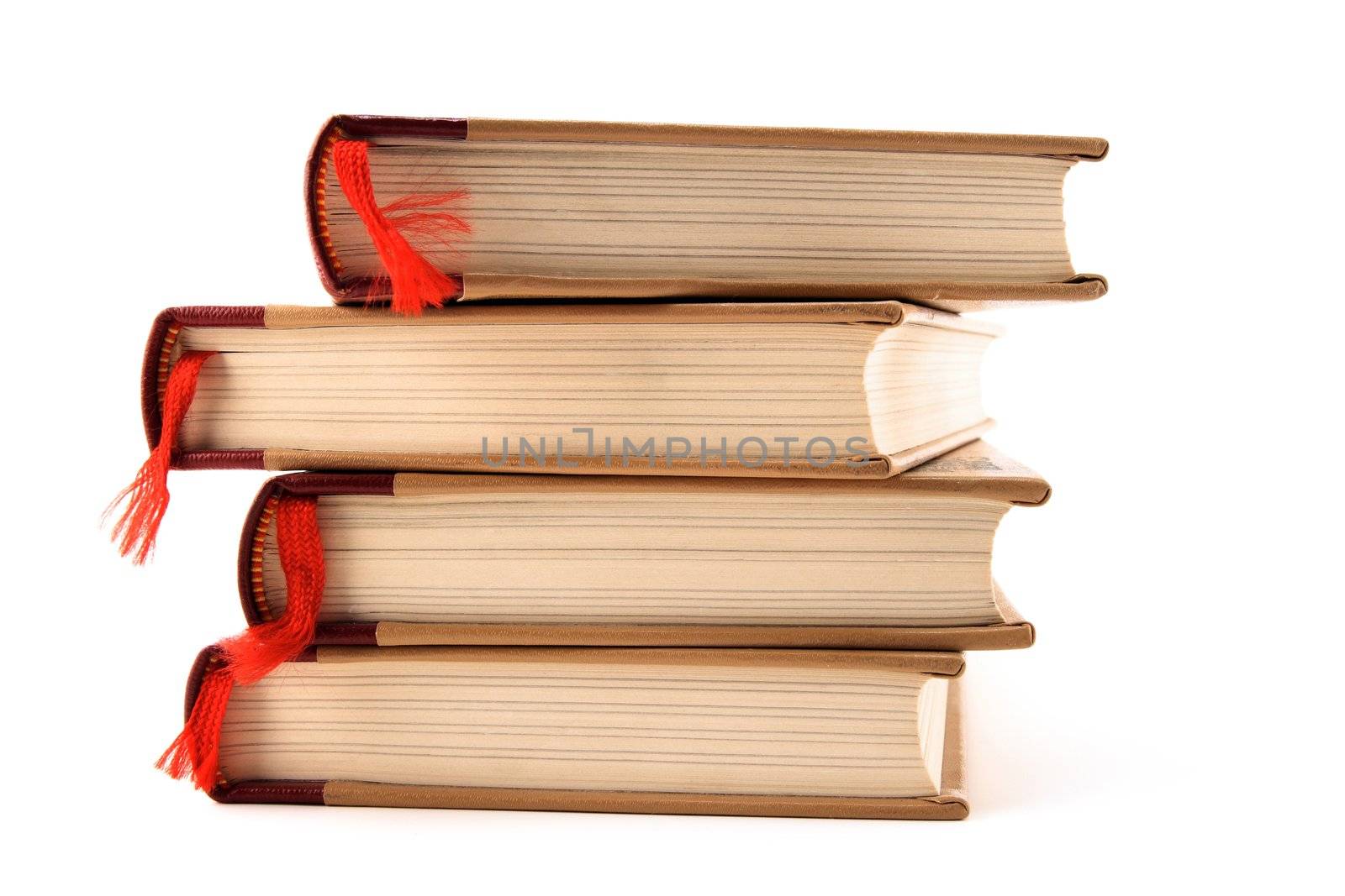 Four stacked books with red bookmarks isolated on white background.