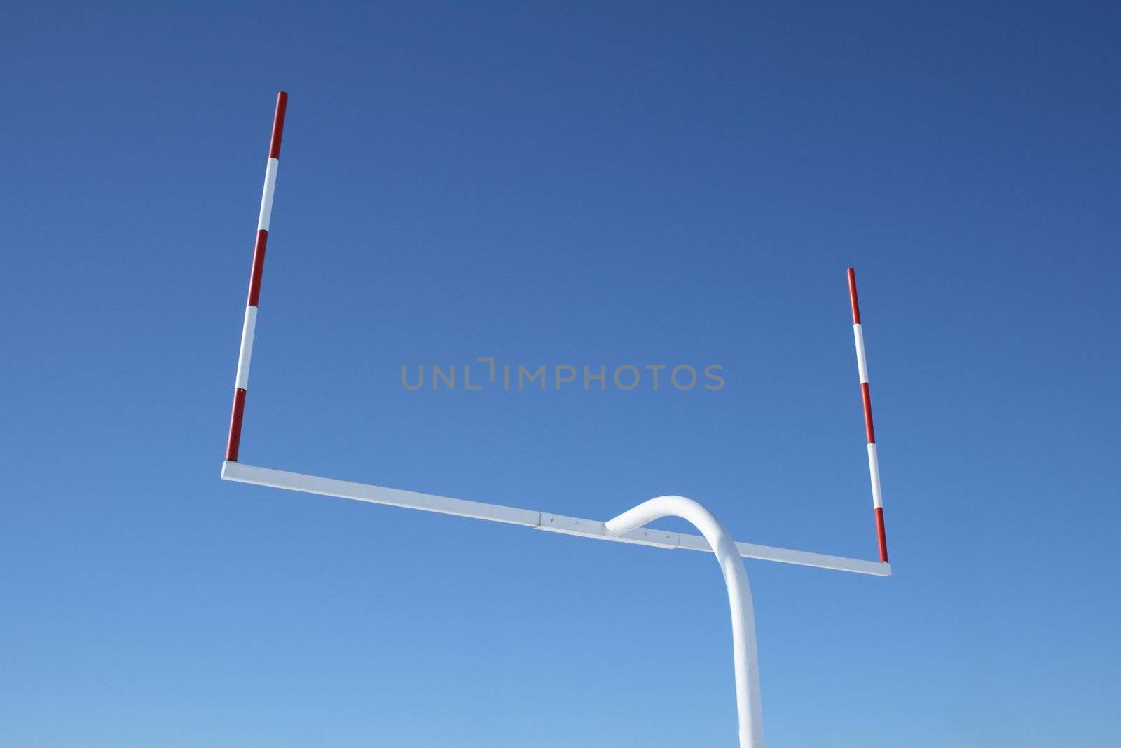 Uprights of American football goal posts against the blue sky.