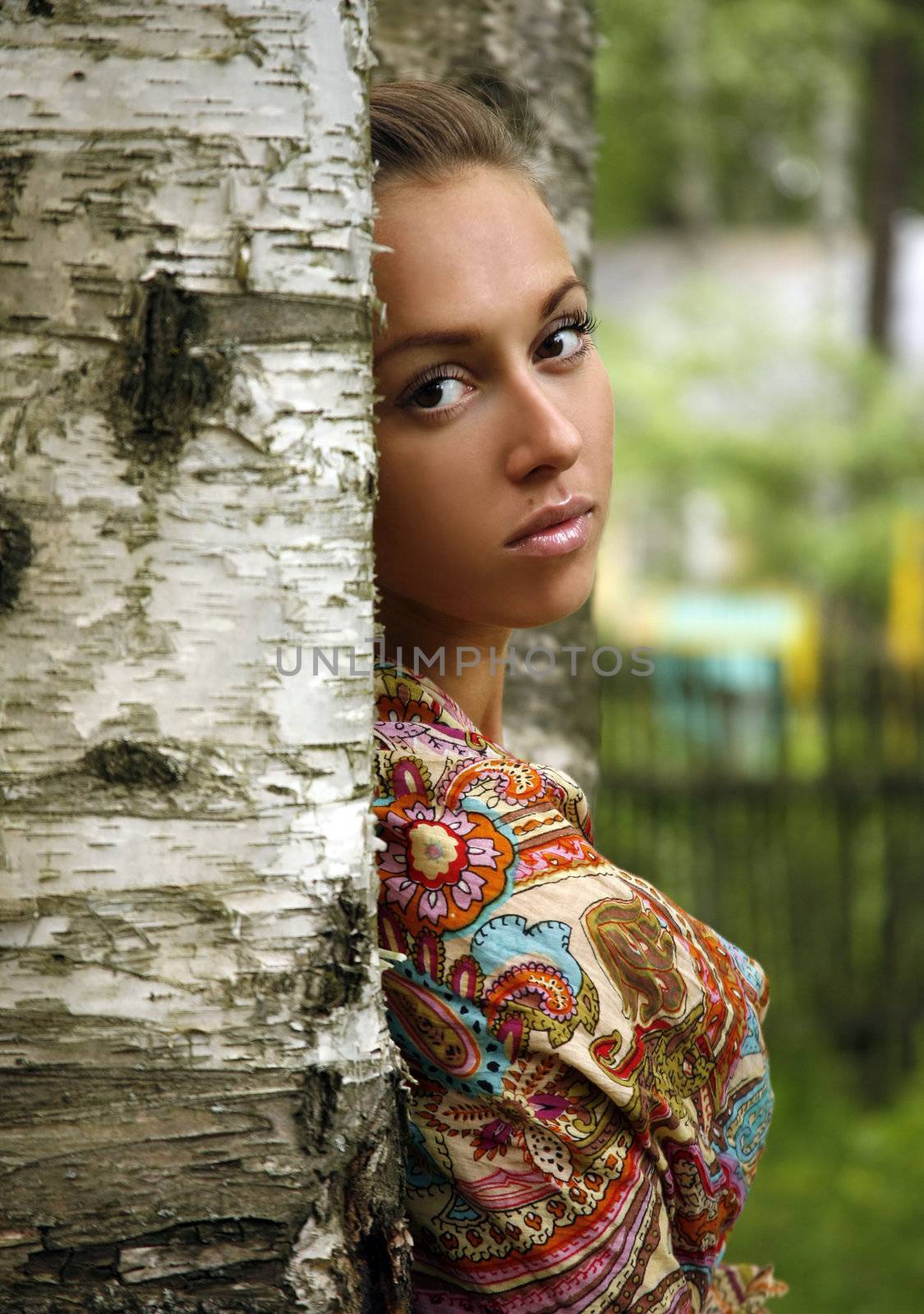 Portrait of the beautiful girl at a birch