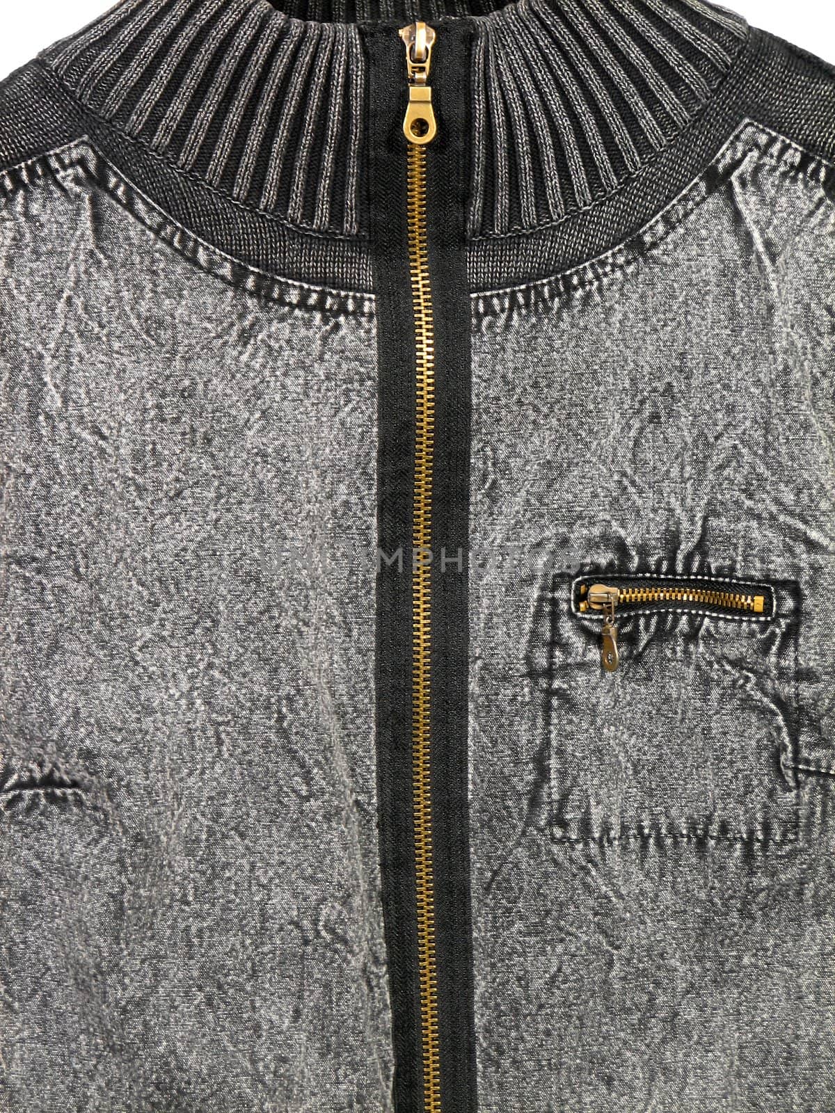 Closeup of a grey denim jacket with zippers.