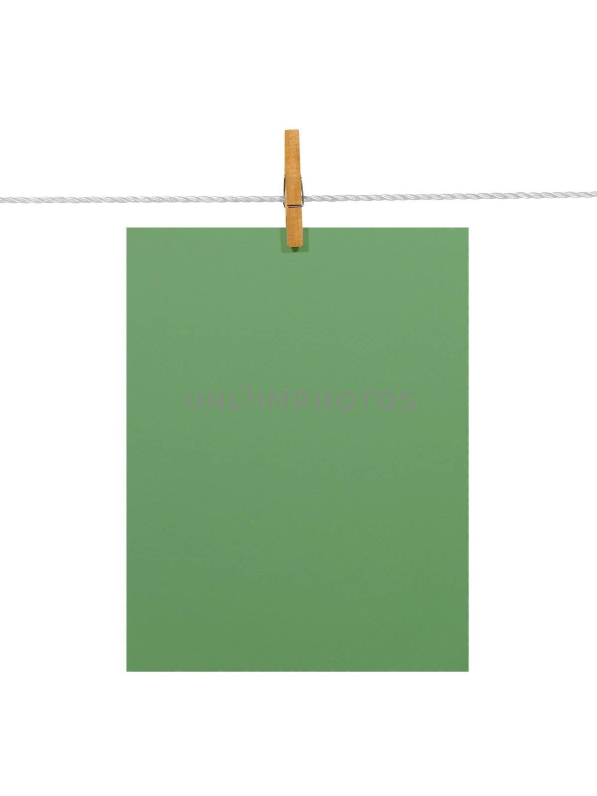 Green blank paper sheet on a clothes line. Isolated on white background. Contains two clipping paths: 1) paper, clothes line and clothespin; 2) paper only