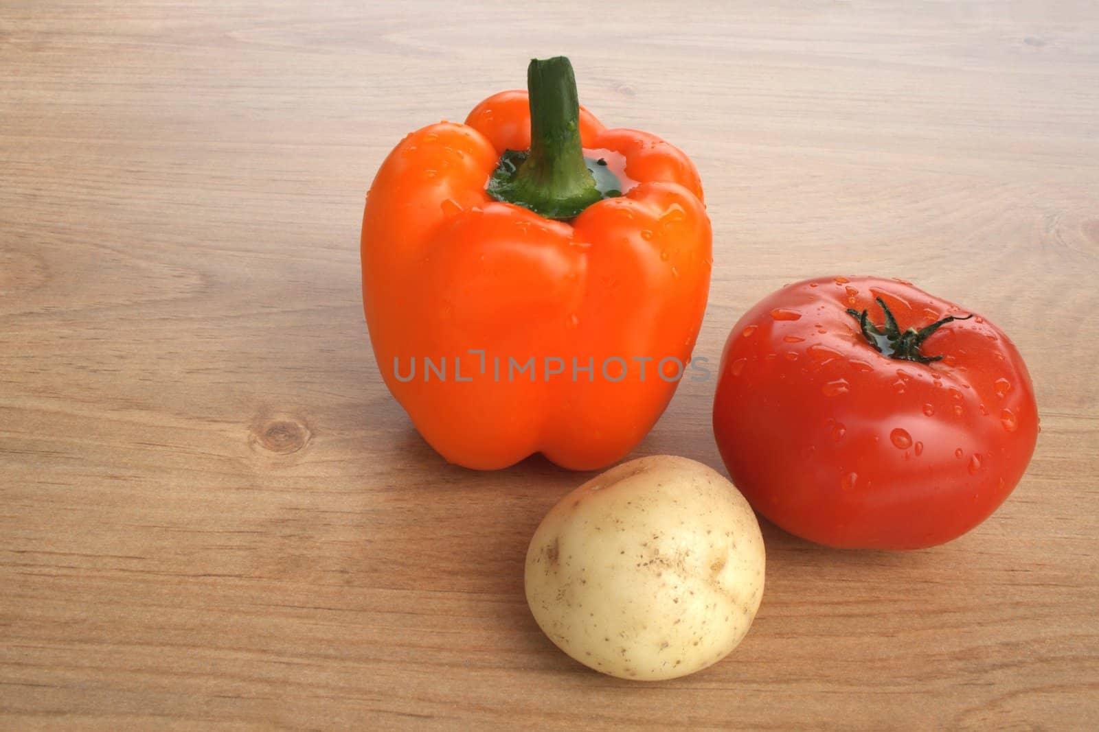 Healthy food. Sweet orange pepper, tomato and potato.