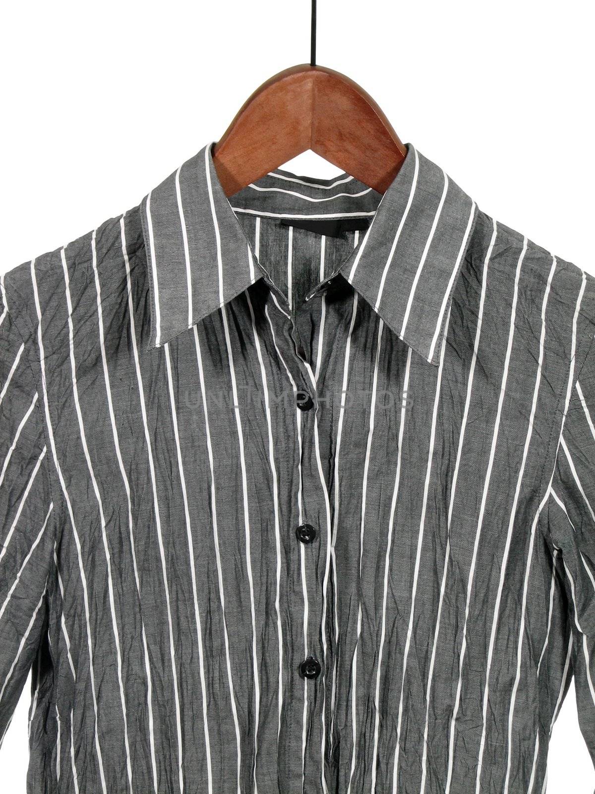 Gray striped shirt on wooden hanger by anikasalsera