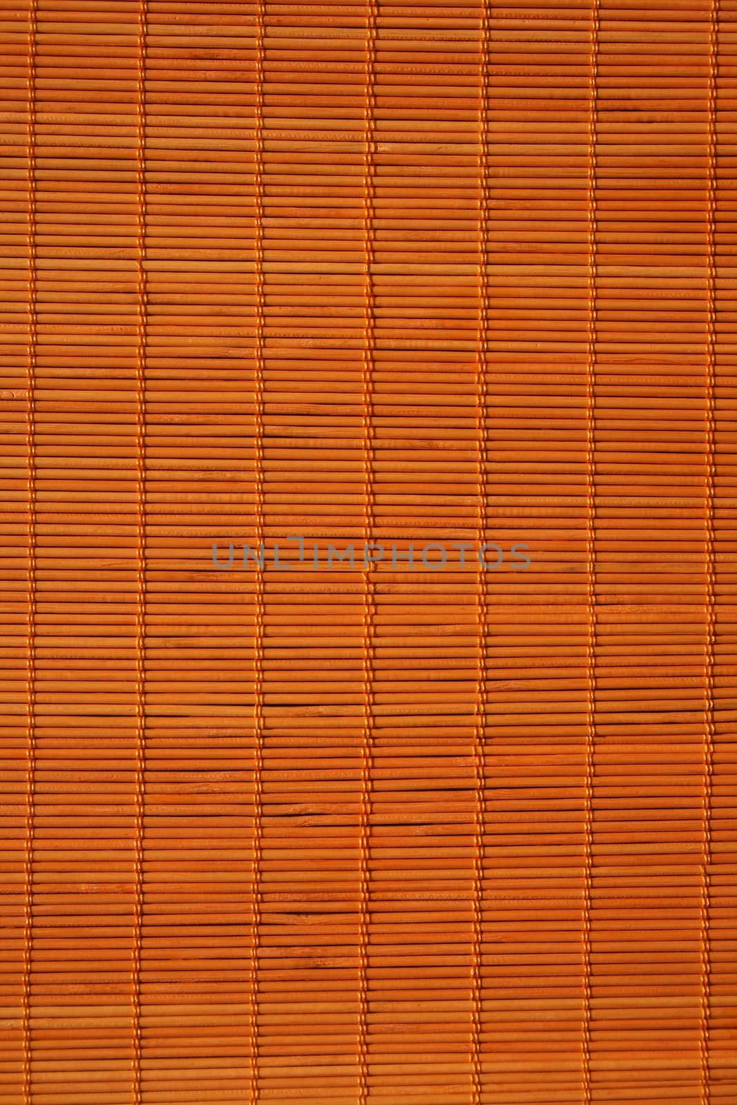 Background: warm orange color of rattan texture.
