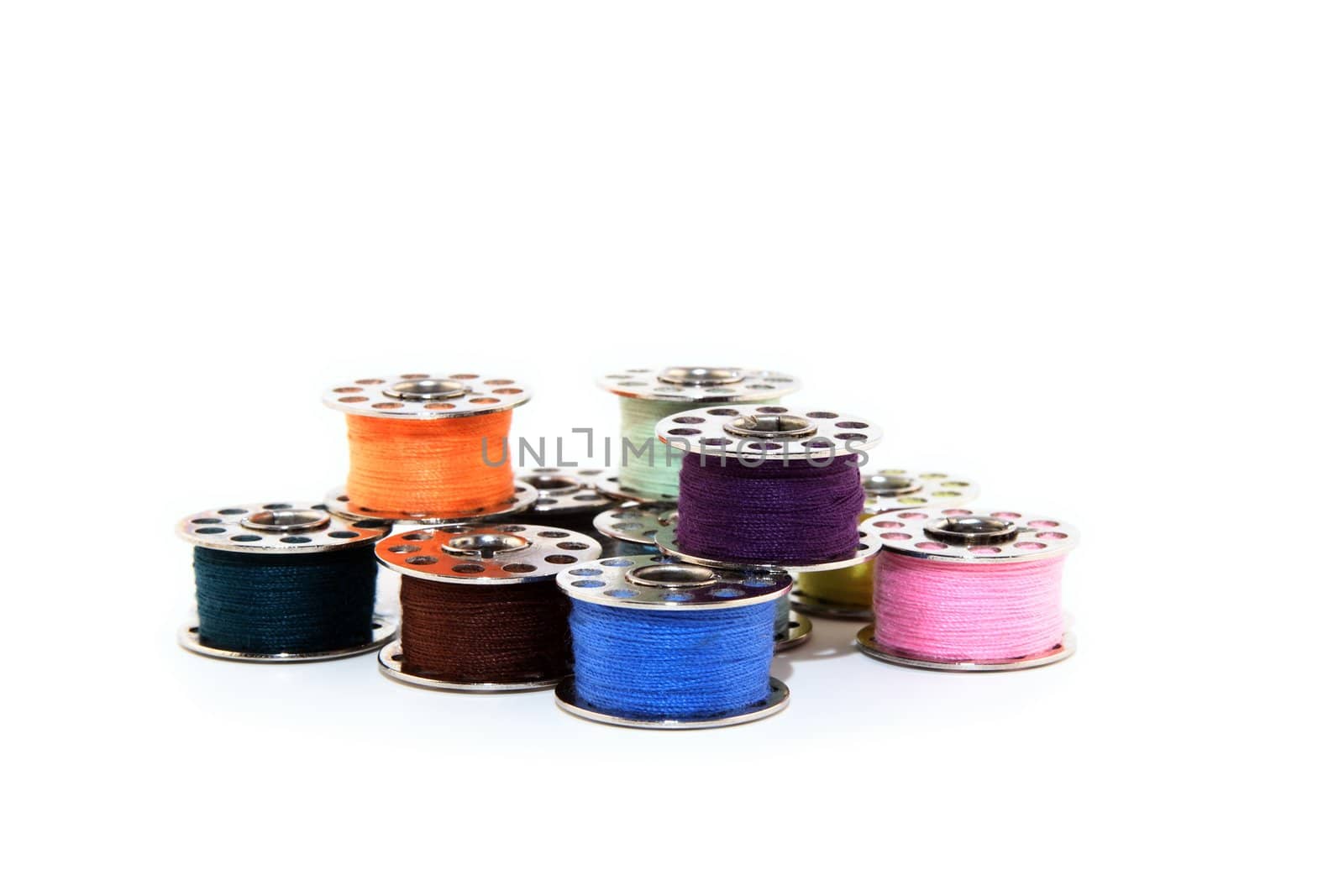 Colorful spools of thread by anikasalsera