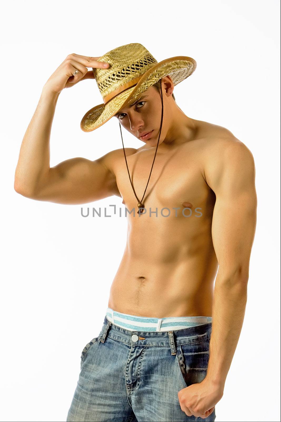 The beautiful young man in a straw hat