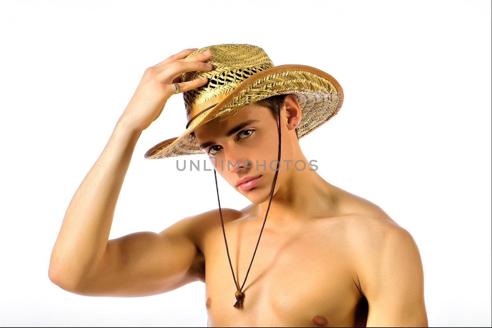 The beautiful young man in a straw hat